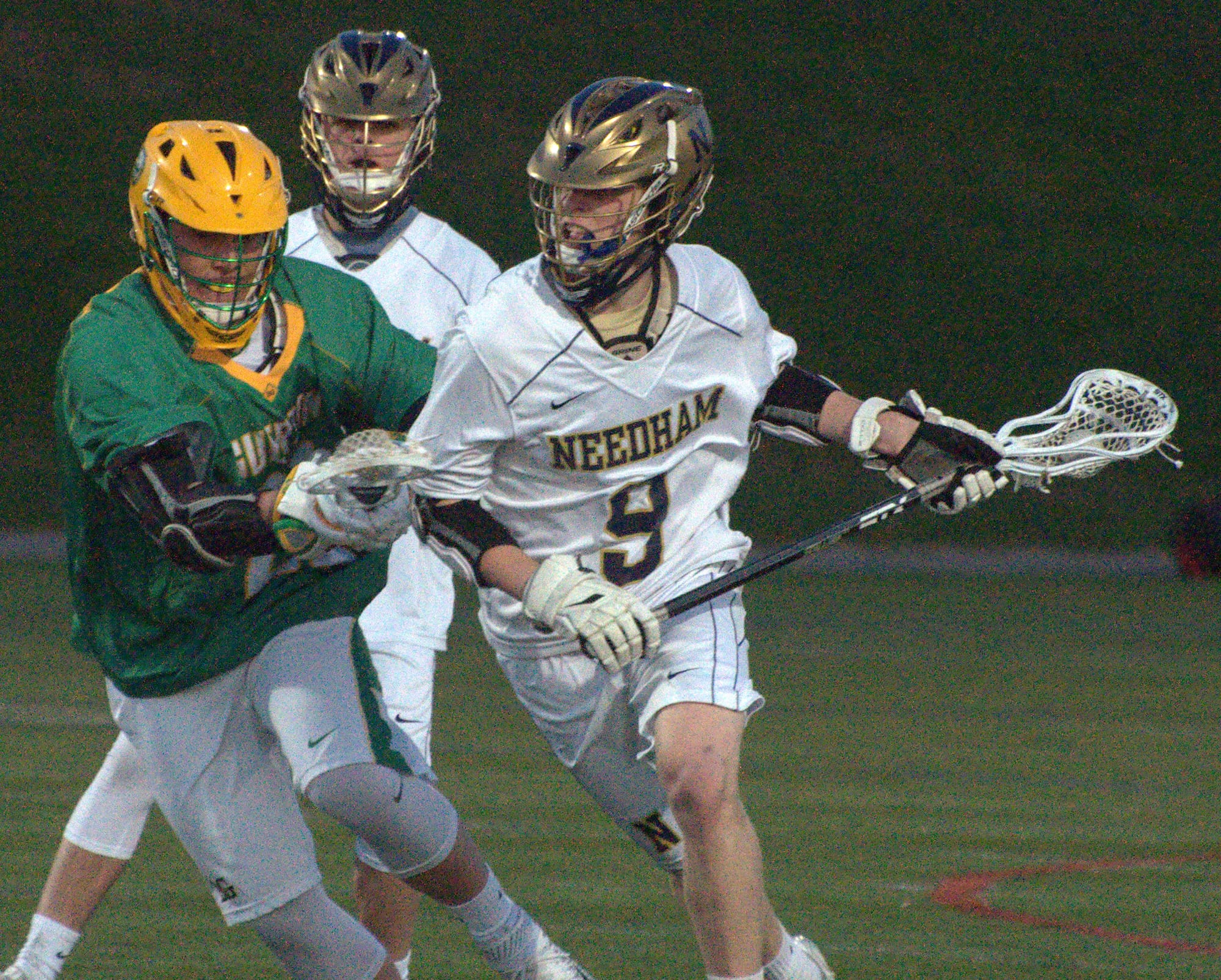 Bishop Guertin's Jordan Caito tries to slow down Needham's Danny McEvoy.