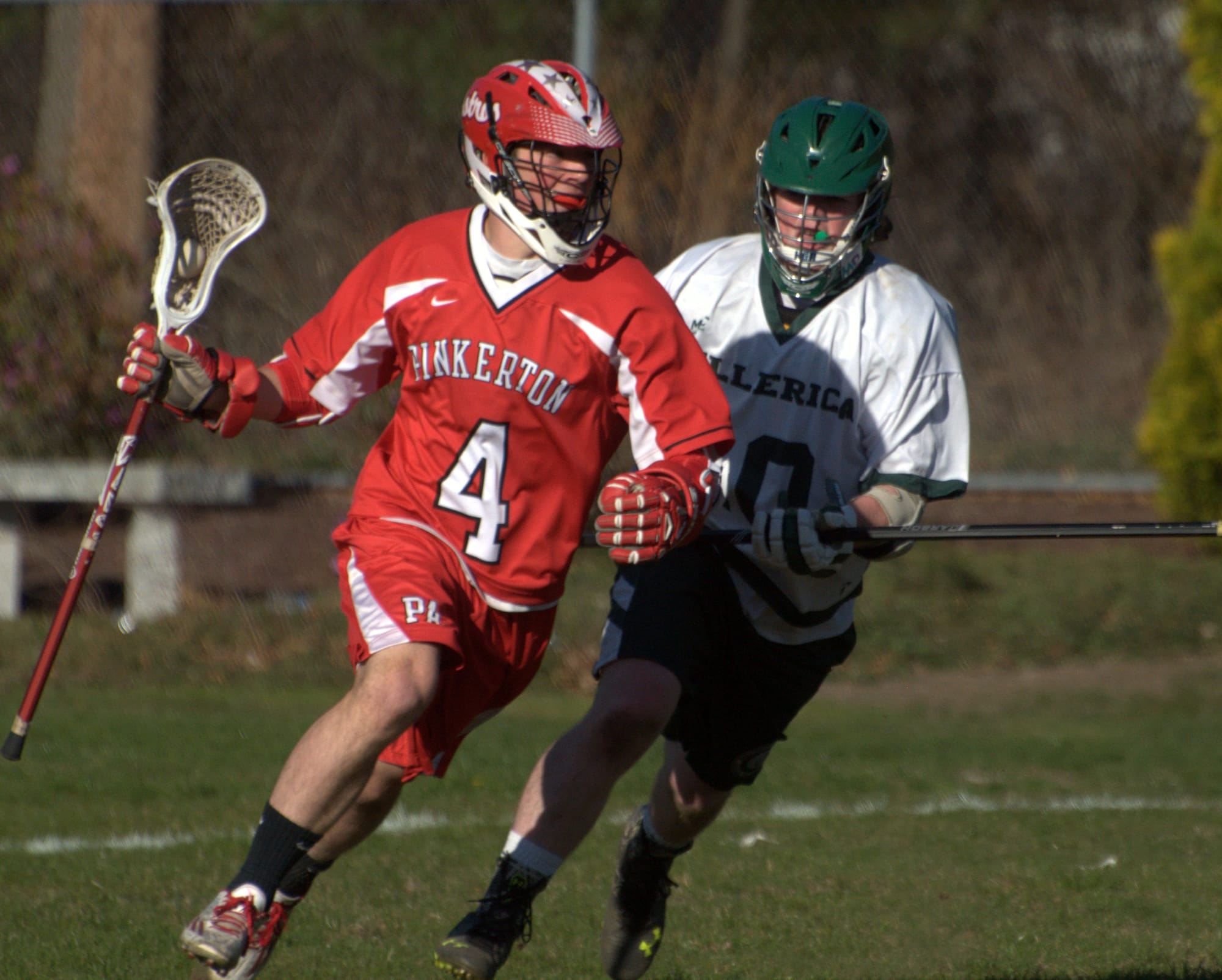 Billerica's Mitchel McLaughlin chases after Pinkerton's Tom Sweeney.