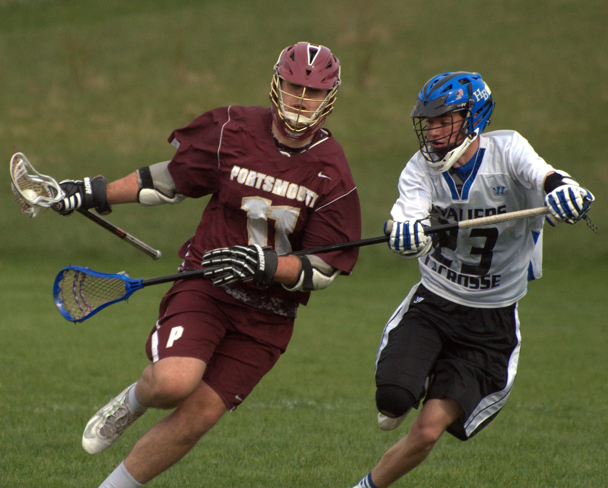 Portsmouth's John Franks tries to get by Hollis Brookline's 