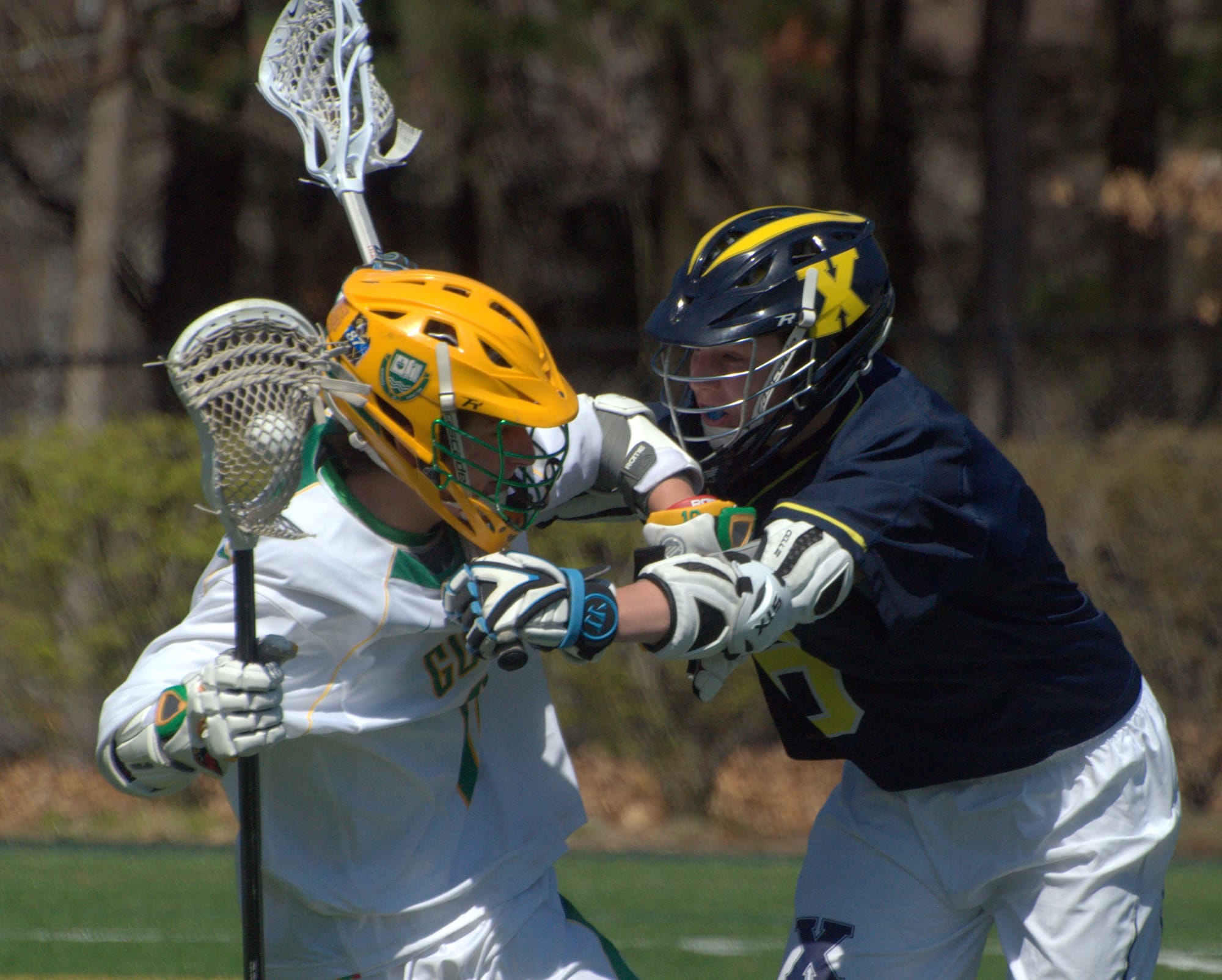 Bishop Guertin's Michael O'Reilly tries to avoid a hit by Xaverian's Jack Whalen.