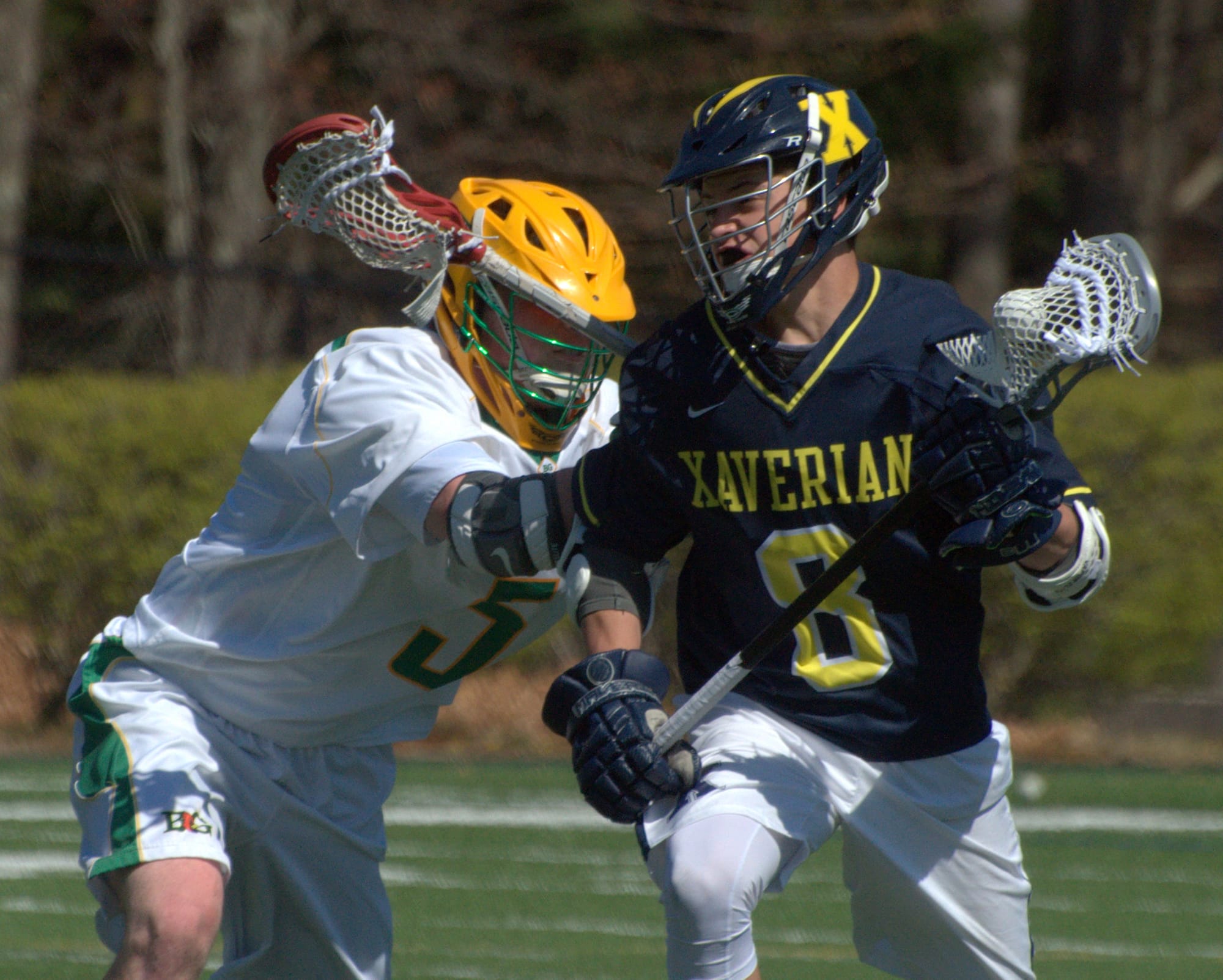Bishop Guertin's Charlie O'Brien tries to slow down Xaverian's Jack Whalen.