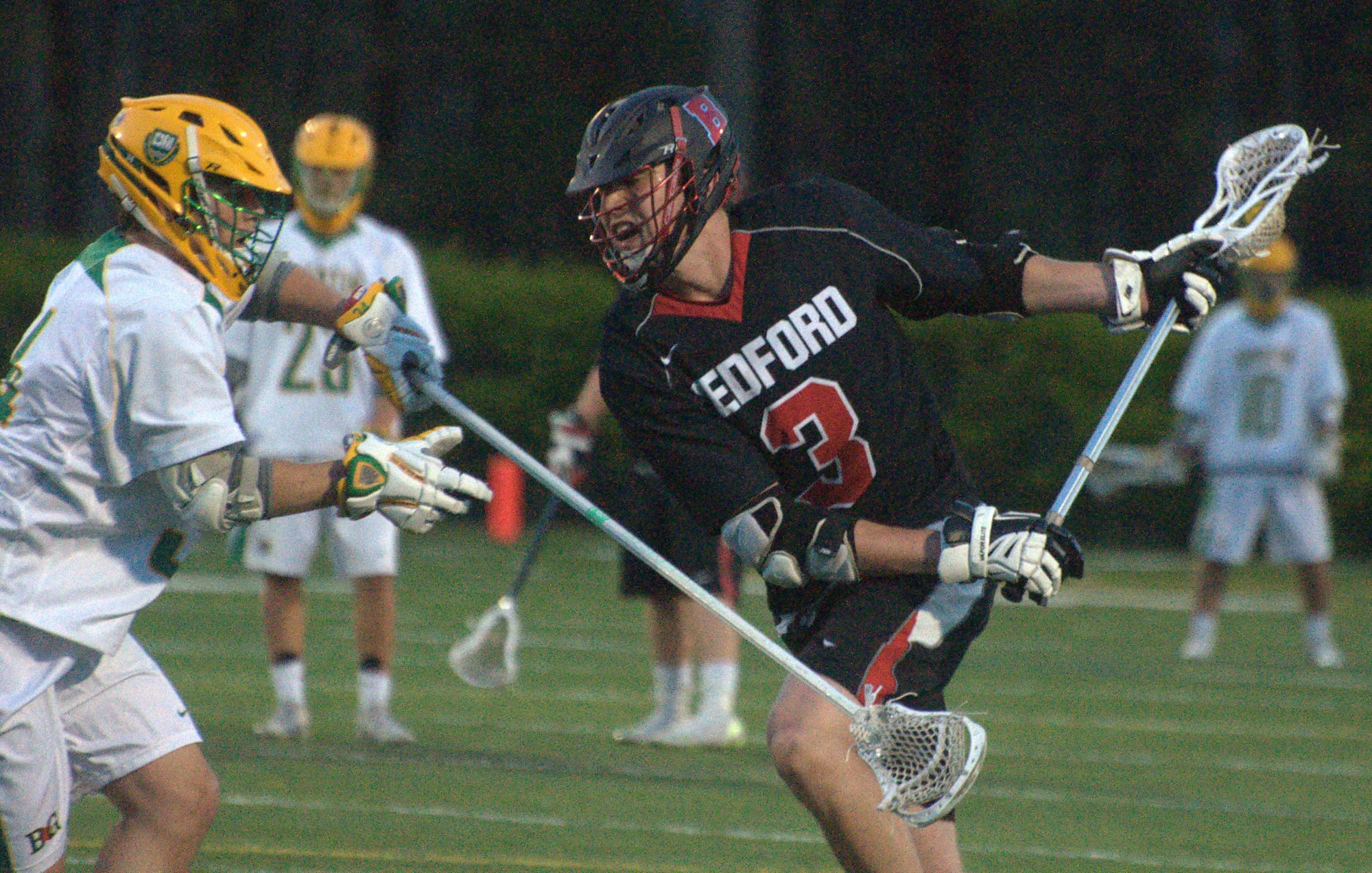 Bedford's Colby Gendron tries to go by Bishop Guertin's Will Lewis.
