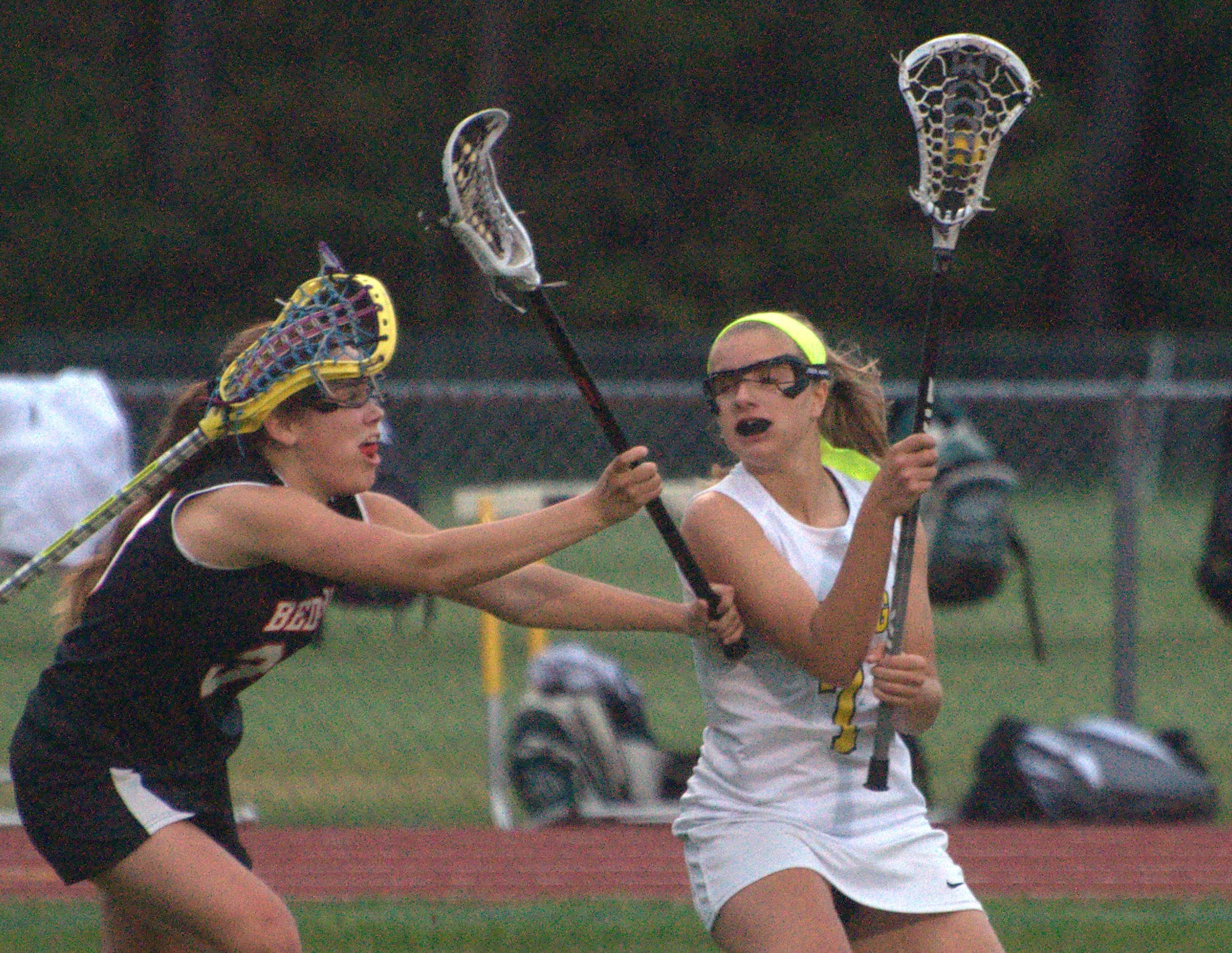 Souhegan's Sammi Jay tries to go by Bedford's Sydney Lynch.