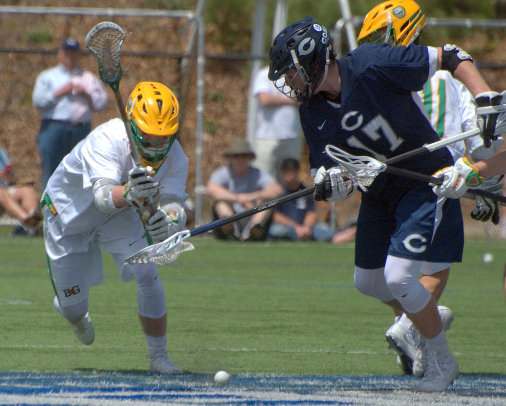 Bishop Guertin's Jack McNallen and Cohasset's Jack Donohue go after a groundball.