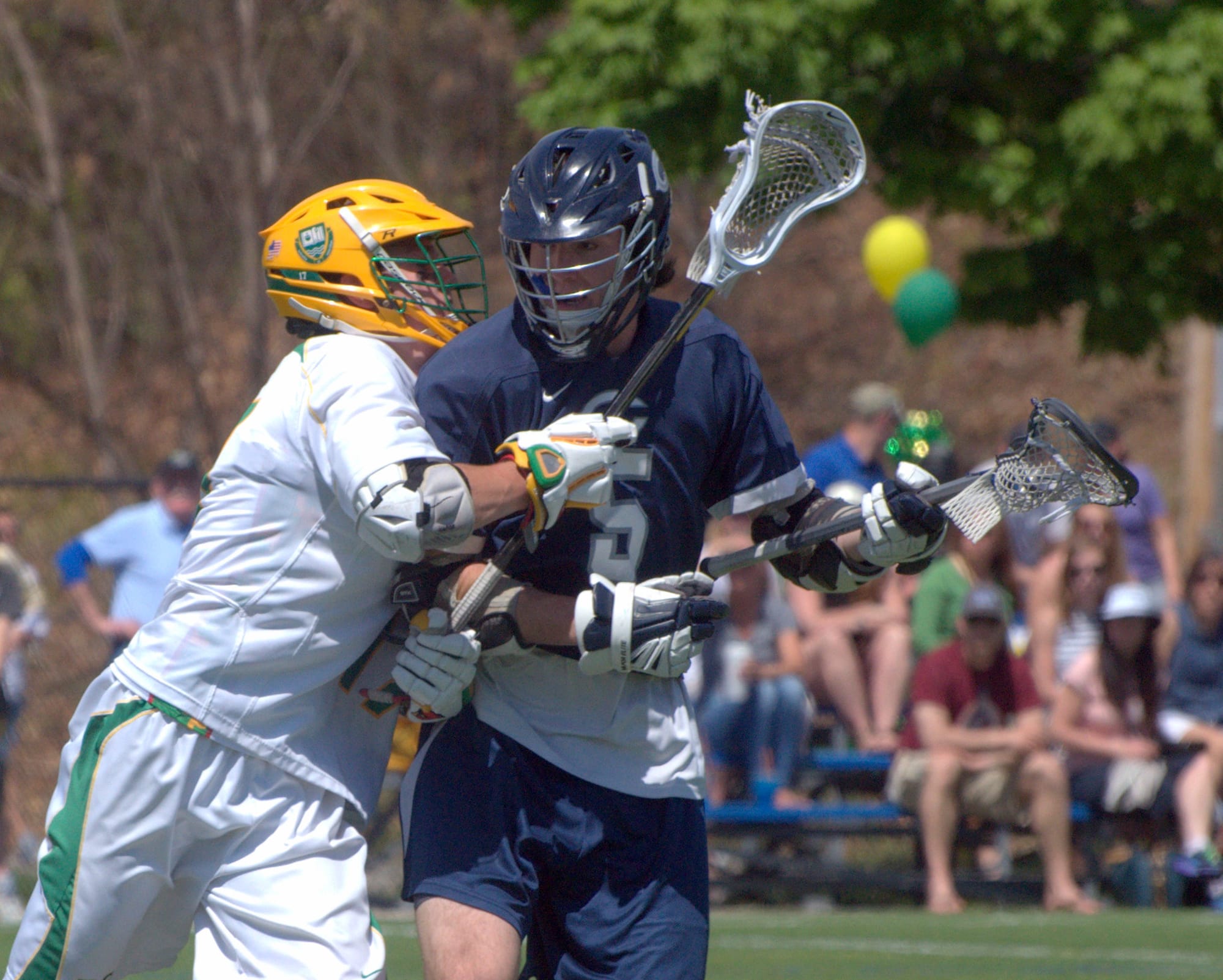 Cohasset's Dan Axelson tries to fight off Bishop Guertin's Tim Hinrichs.