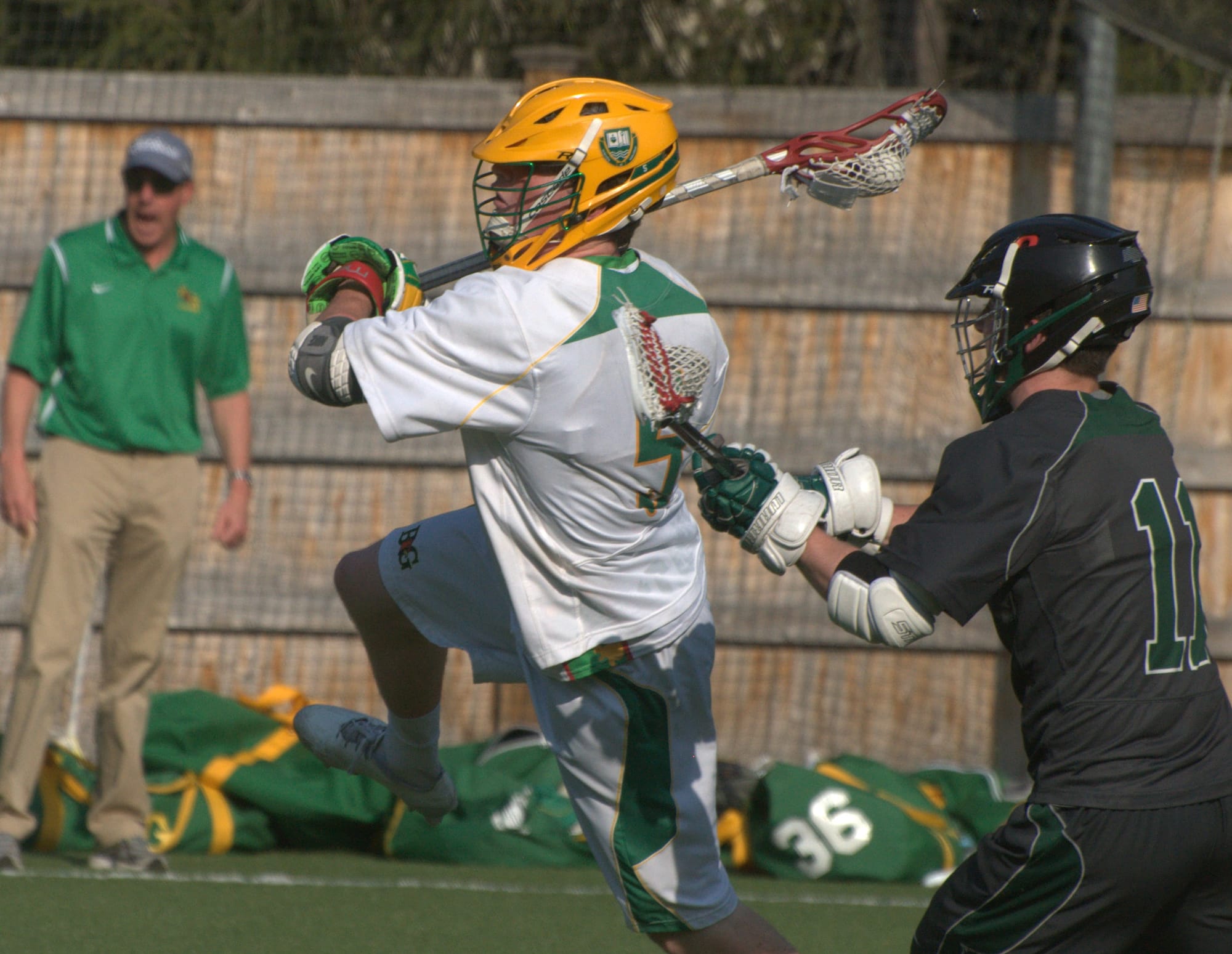 Bishop Guertin's Charlie O'Brien takes a shot as Duxbury's Ben Sanchez tries to defend.