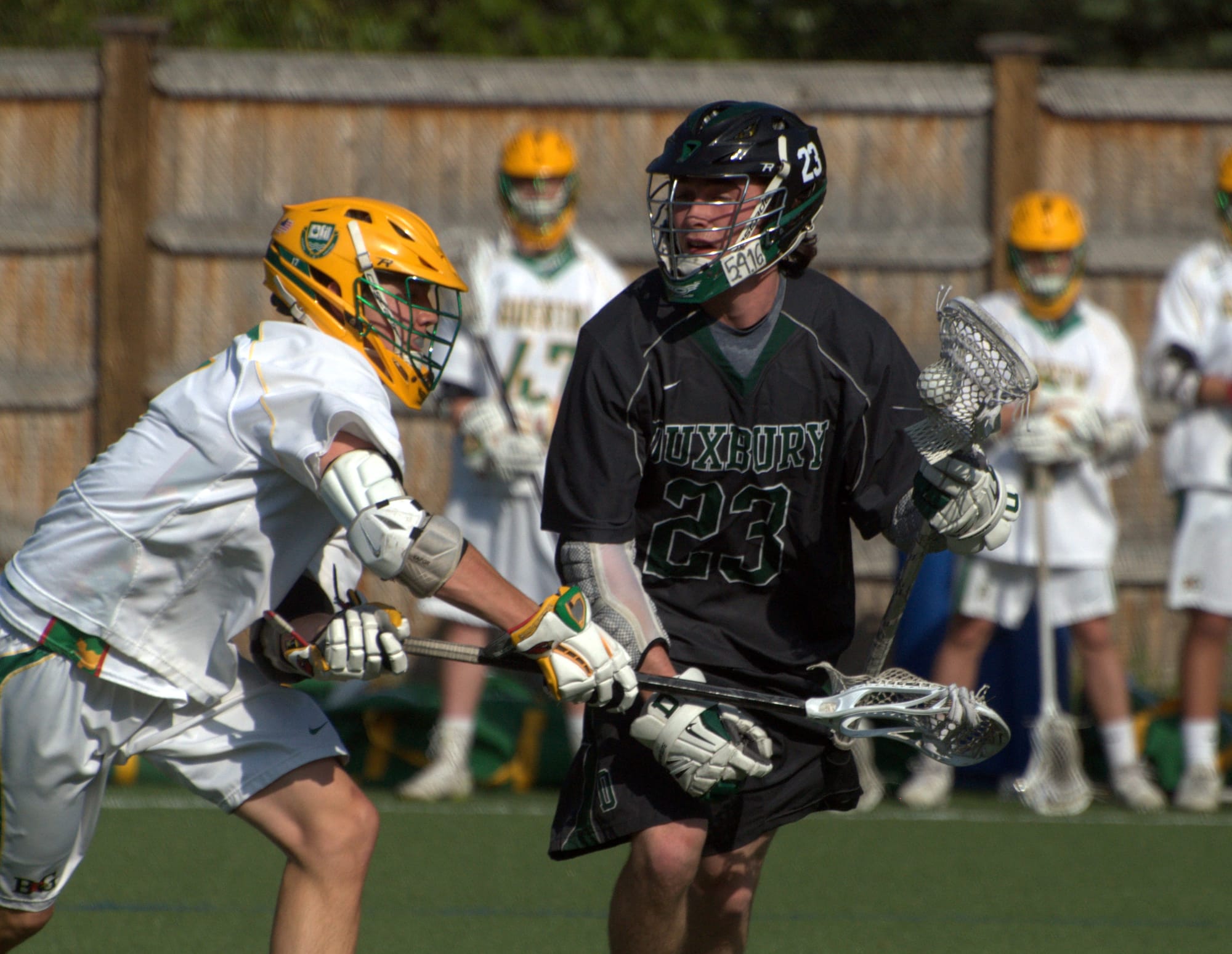 Bishop Guertin's Tim Hinrichs defends against Duxbury's Harrison Piper