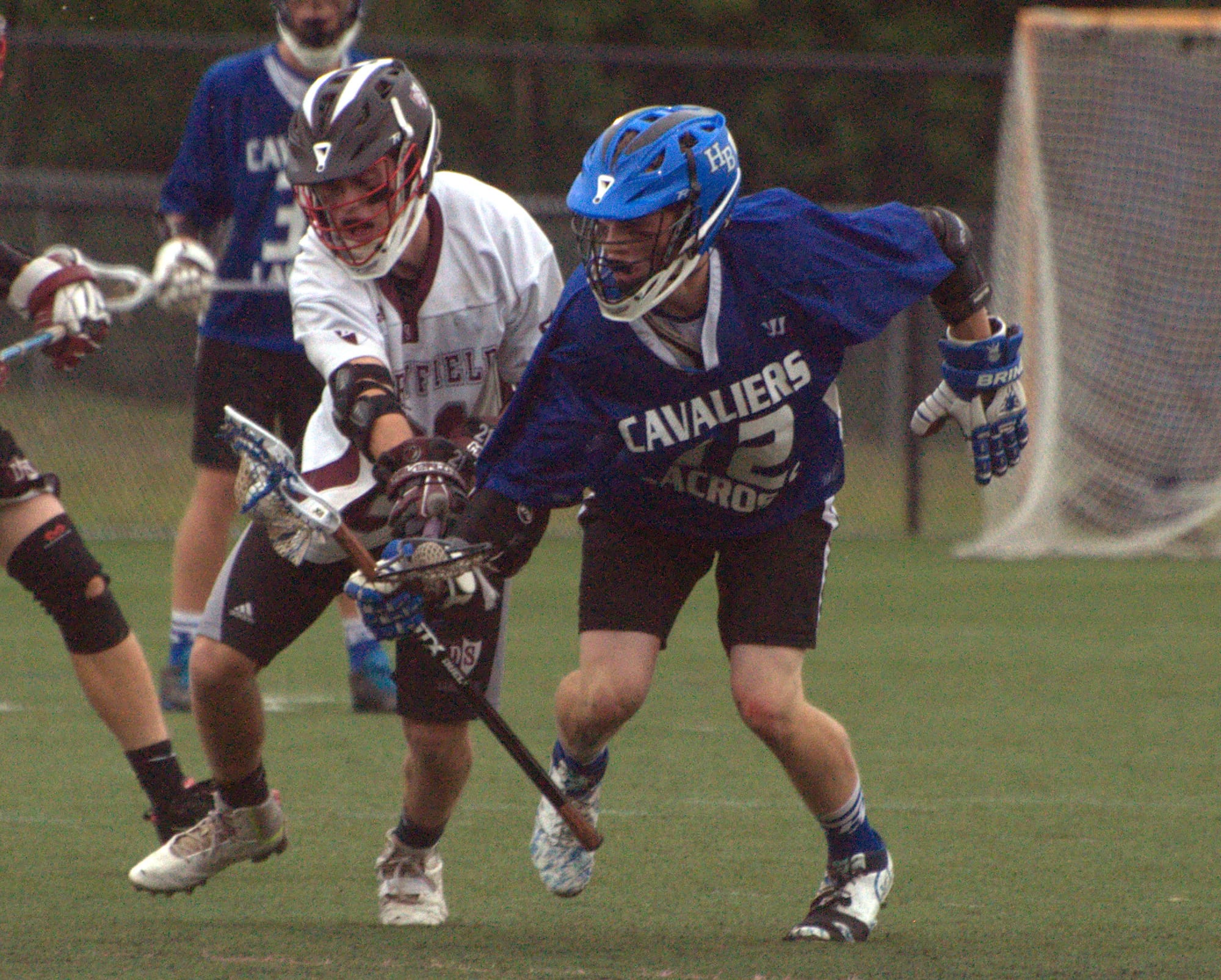 Derryfield's Matt Dubreuil and Hollis Brookline's Derek Davidson battle for the ball.