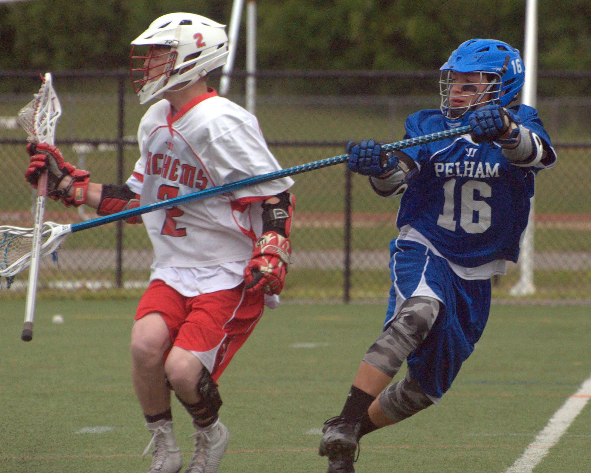 Pelham's Manny Baisley tries to slow down Laconia's Kyle Chiasson.