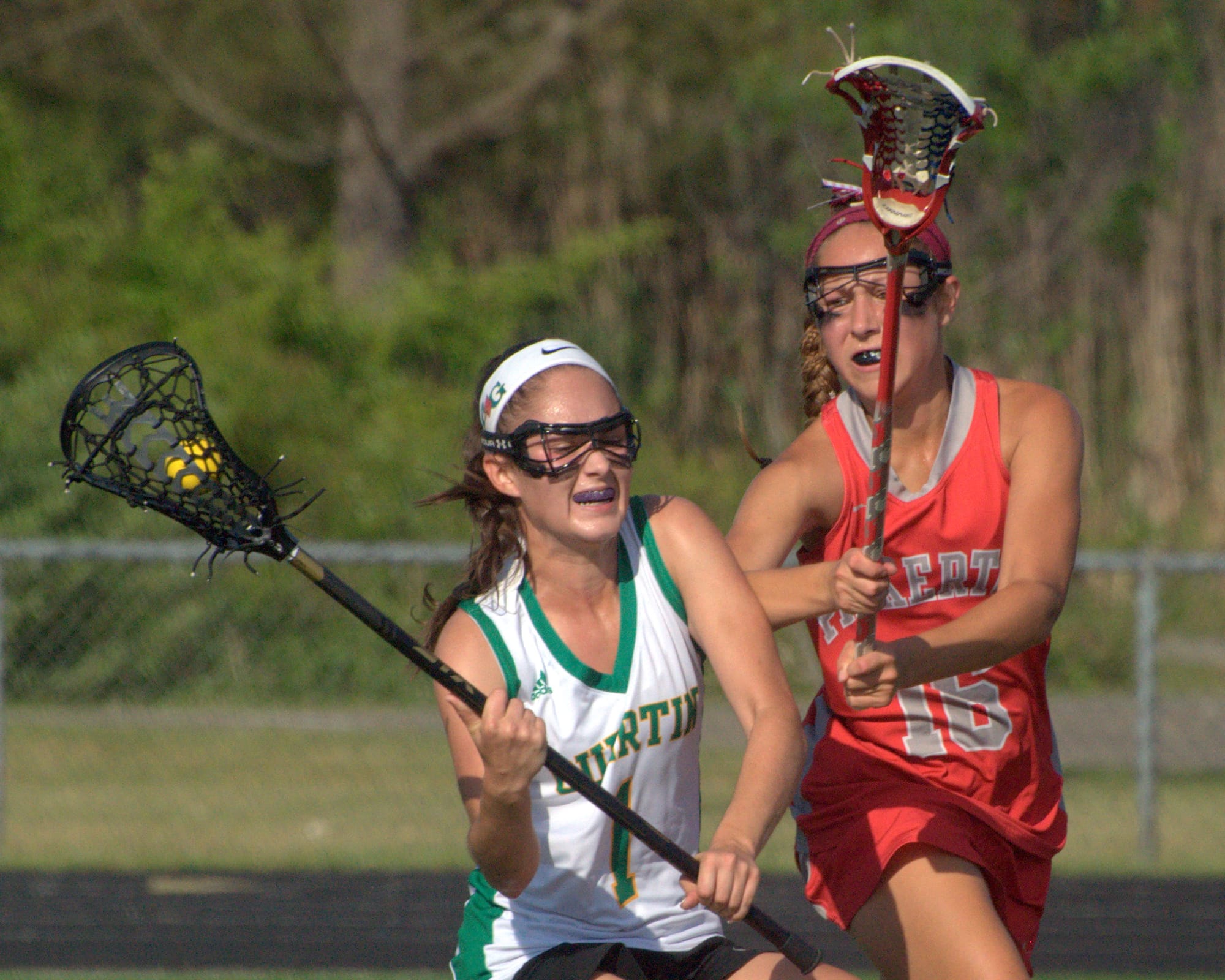 Pinkerton's Kiley Davis tries to slow down Bishop Guertin's Olivia Koutsos.