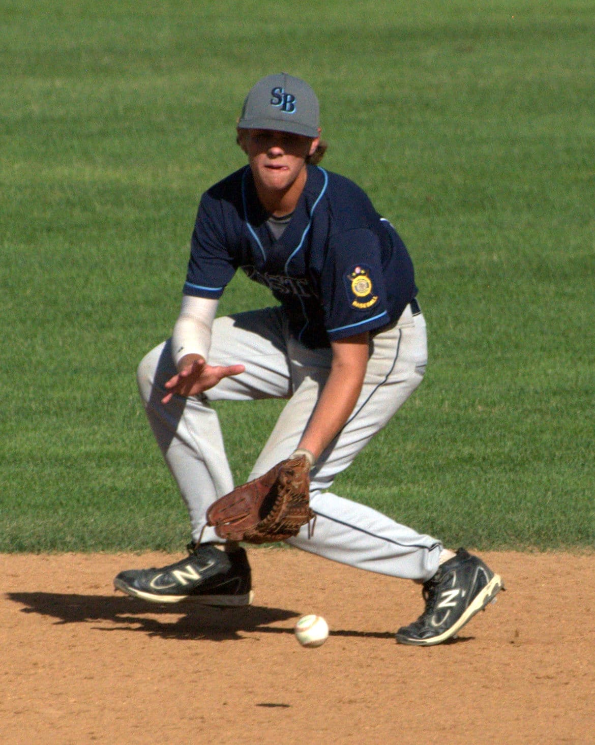 Bedford's Ryan Lee fields a groundball during Friday's game against Dover.
