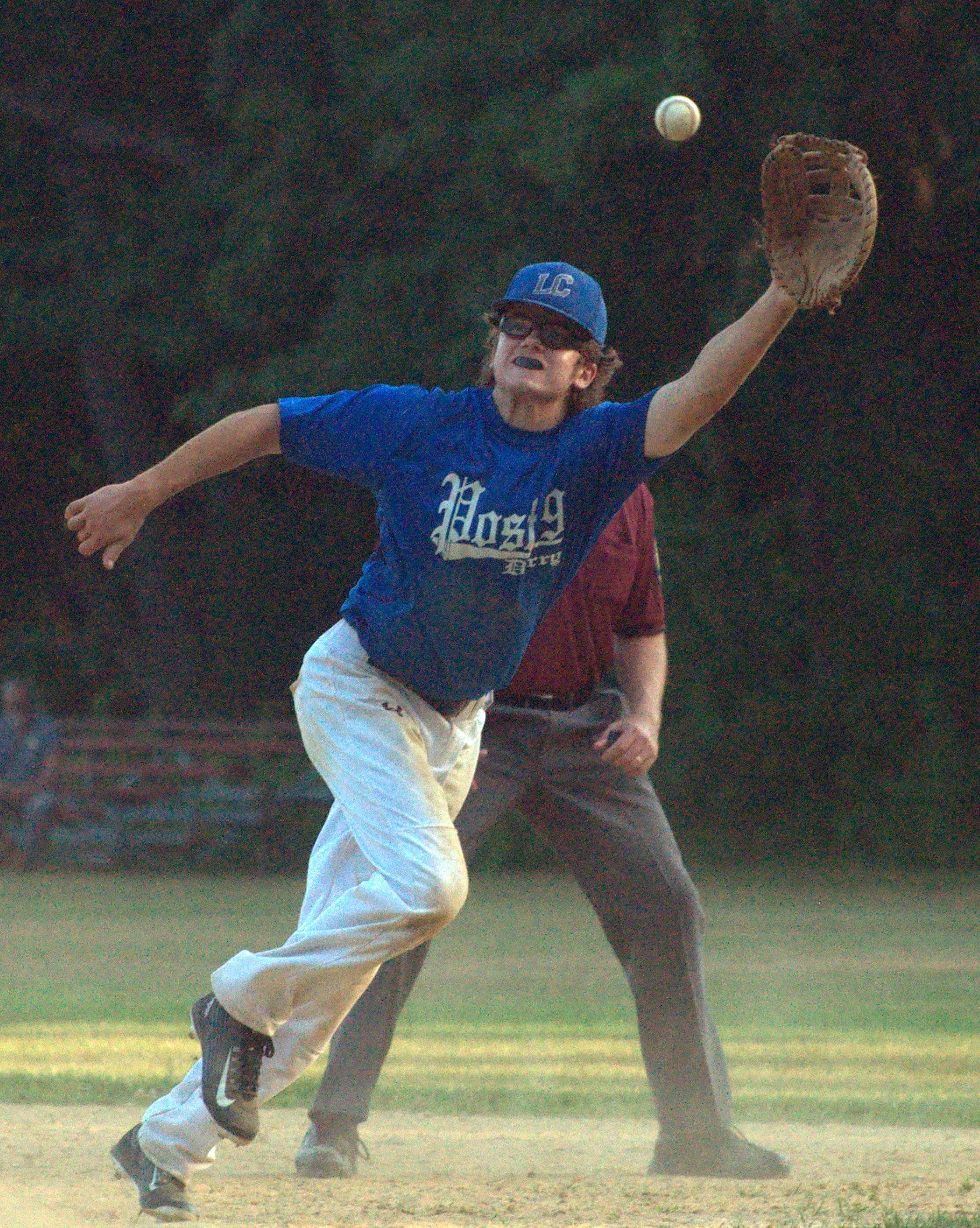 Derry's Brian Sutton reaches for a throw at first base.