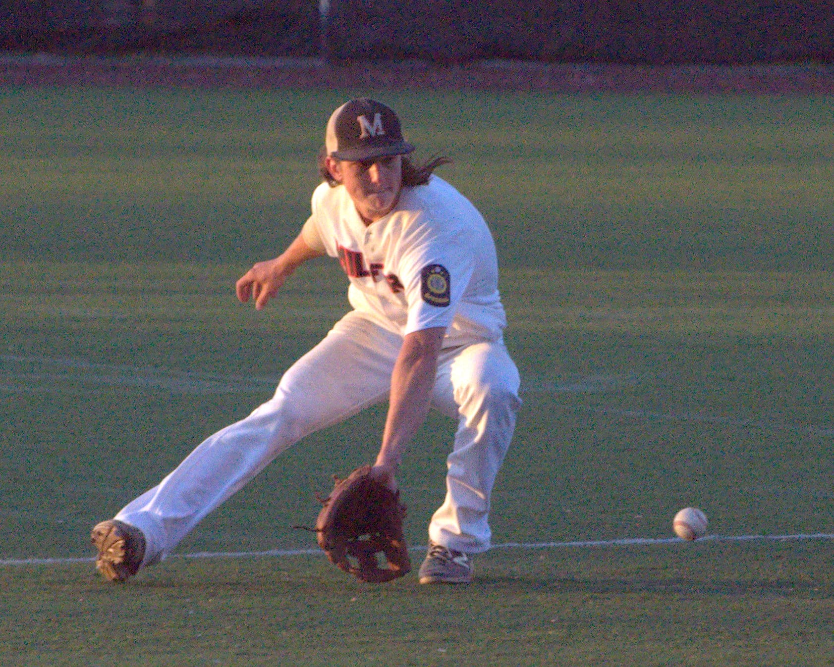 Milford's Thomas Bennett prepares to stop a groundball.