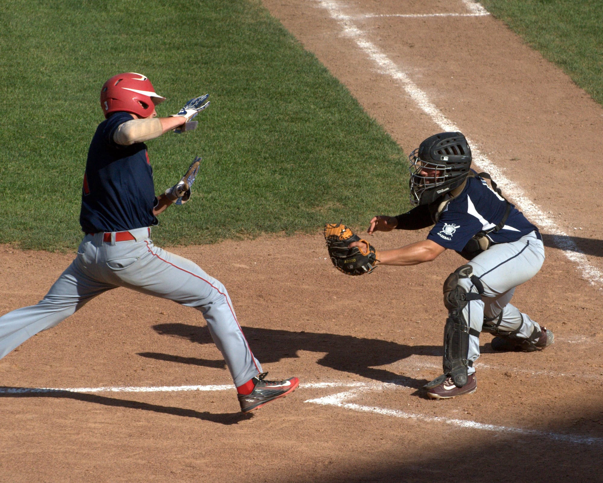 Exeter's Jack Arend prepares to tag out Rochester's Drew Healy.