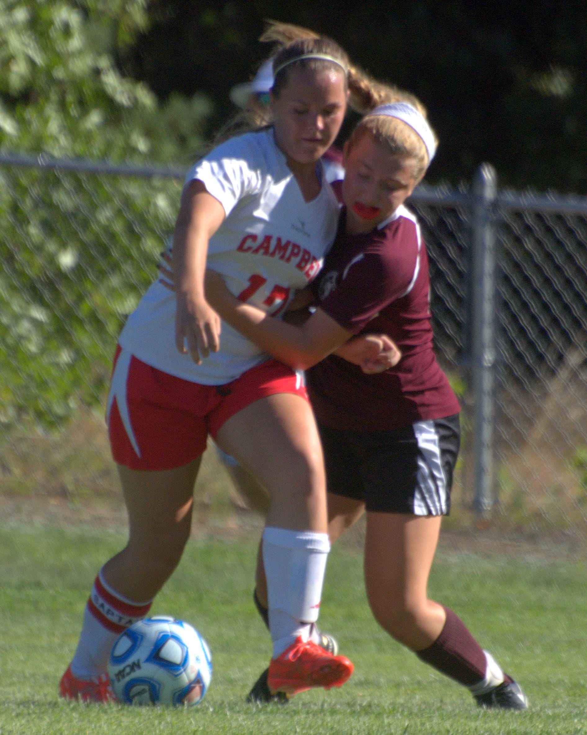 Campbell's Maddi Caron and Derryfield's Madison Thorne battle for the ball.