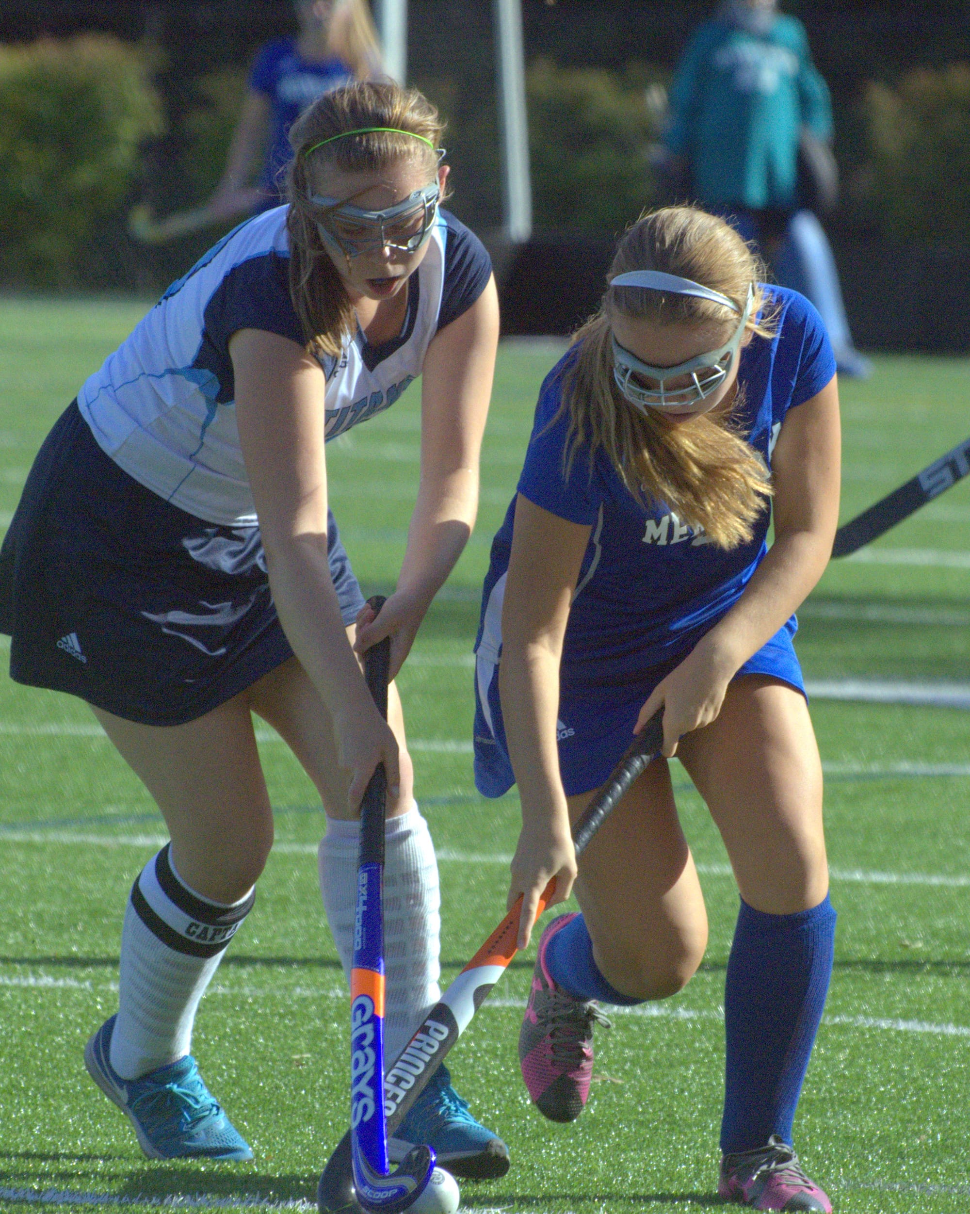 Merrimack's Hunter Webb and Nashua North's Lexi Bernier battle for the ball.