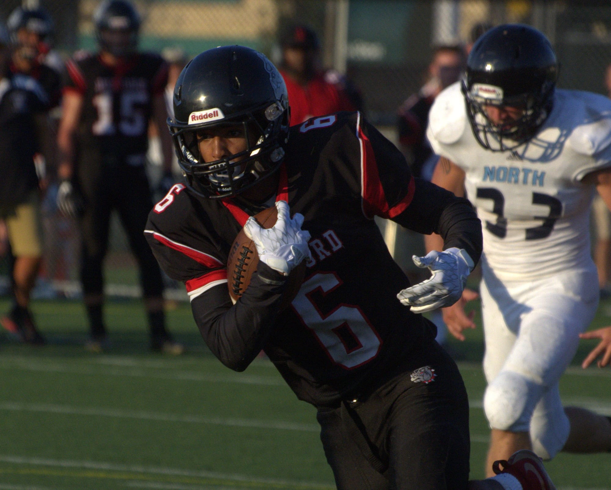 Bedford's Lucien Mumpini picks up yards after a catch against Nashua North.