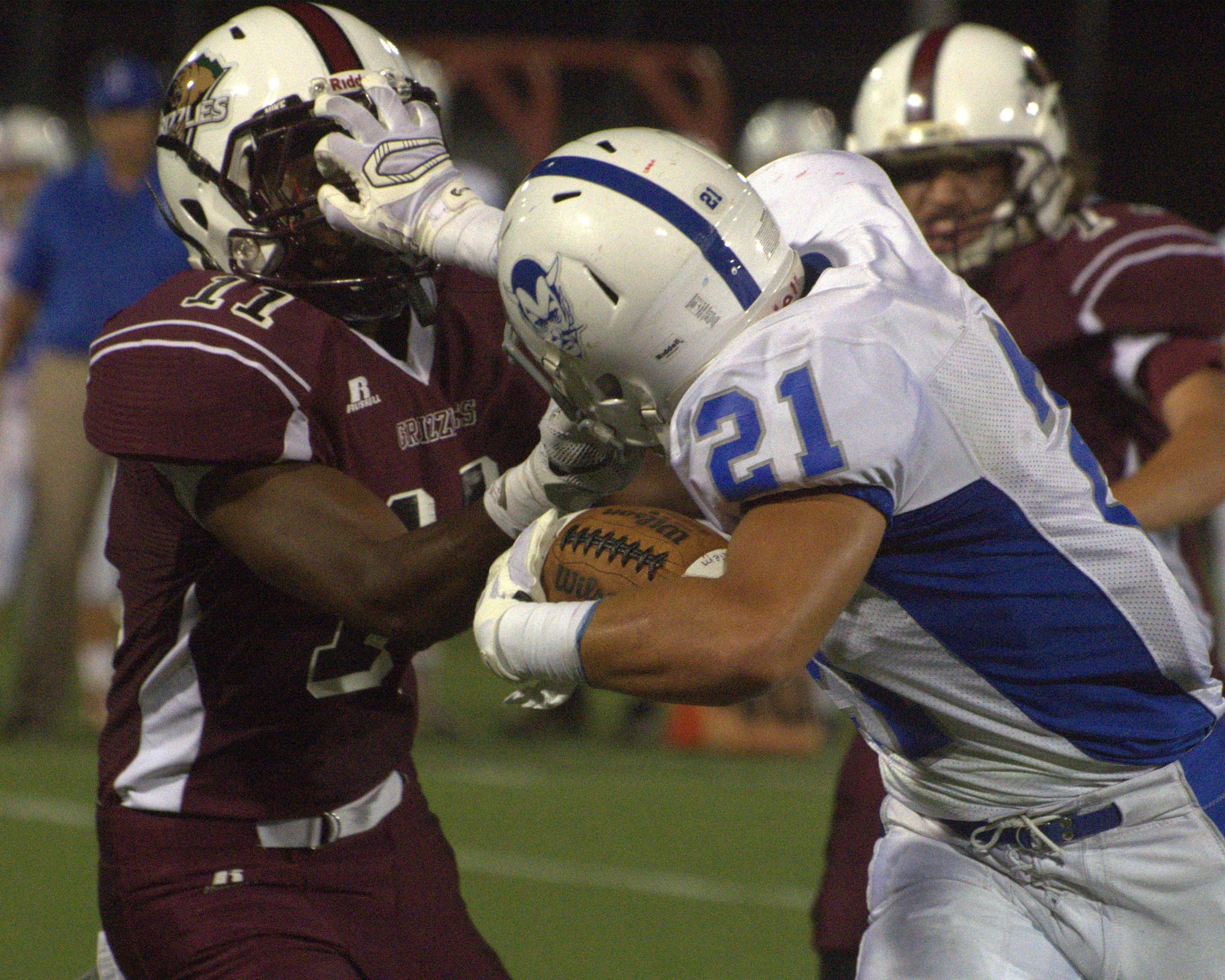 Salem's Adam Maroun stiff arms Goffstown's Franklin Castillo-Diaz.