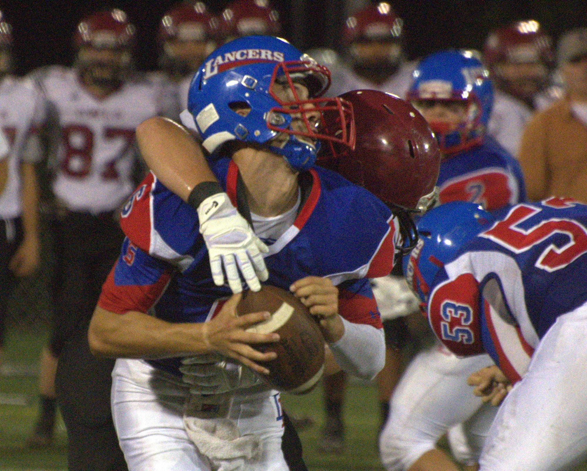 Londonderry's Ben Johnson gets hit by Timberlane's Brandon Berube.