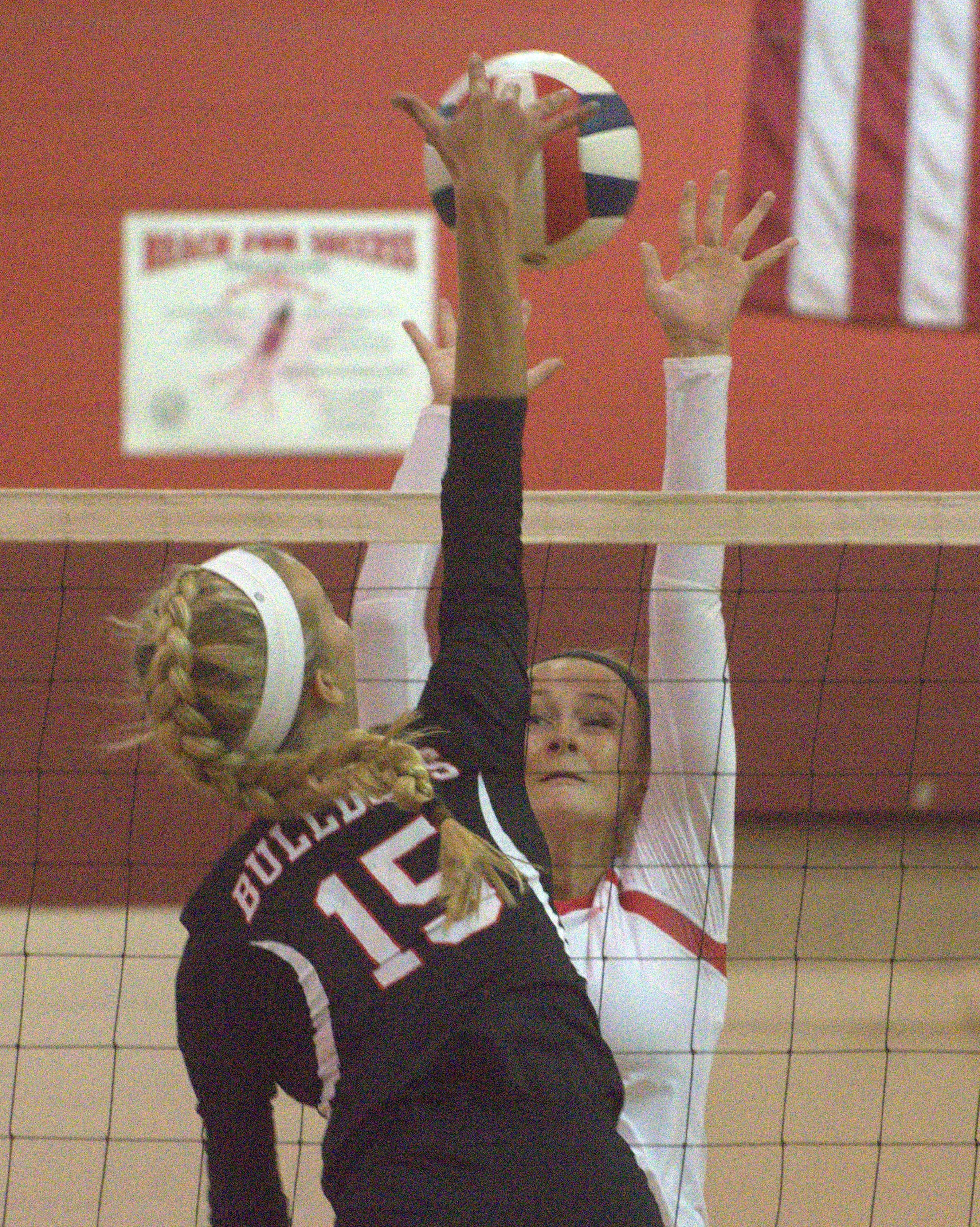Pinkerton's Megan Hough tries to block a ball hit by Bedford's Molly McCoole.