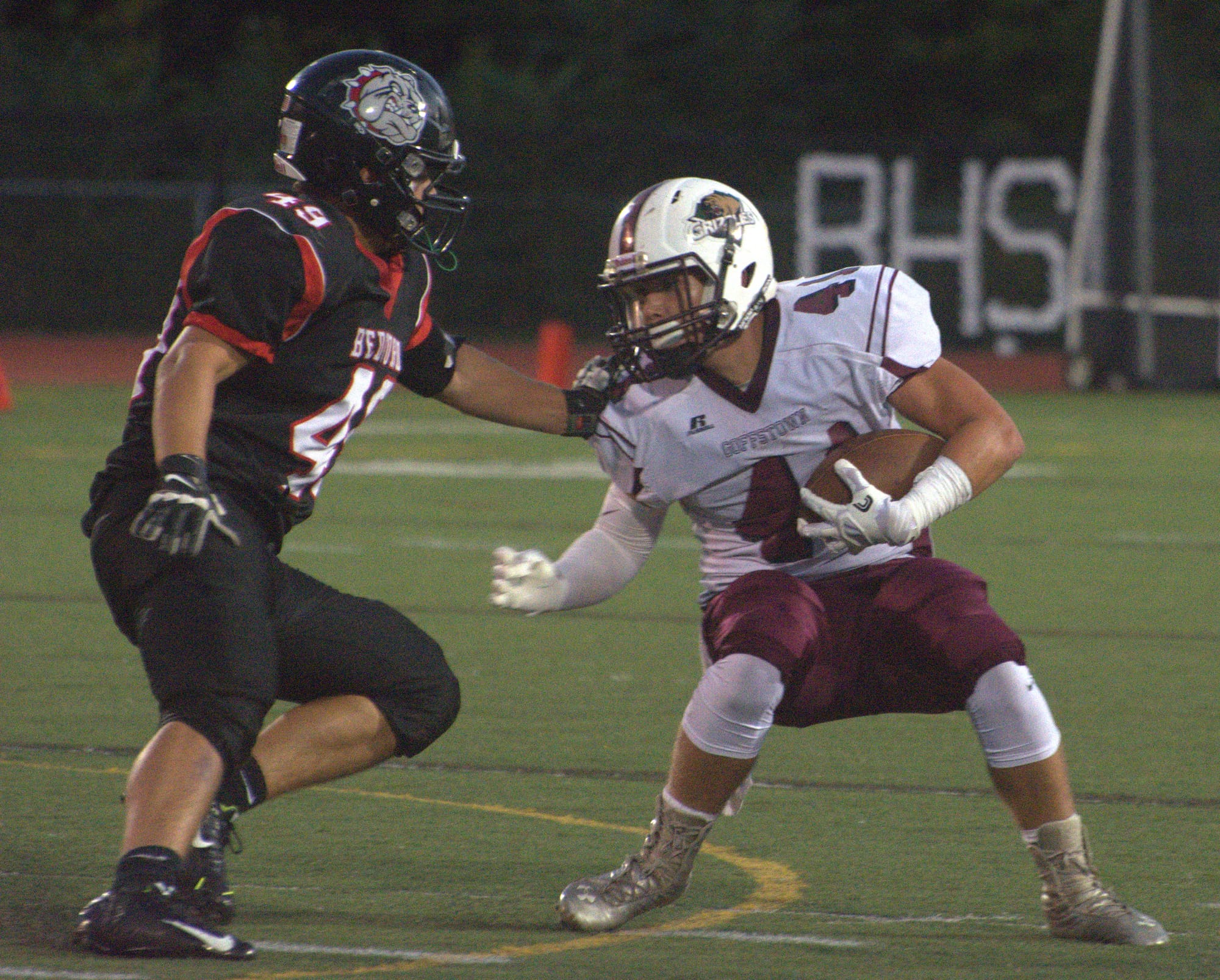 Goffstown's Carter Cormier tries to make a move around Bedford's Brian Thibeault.