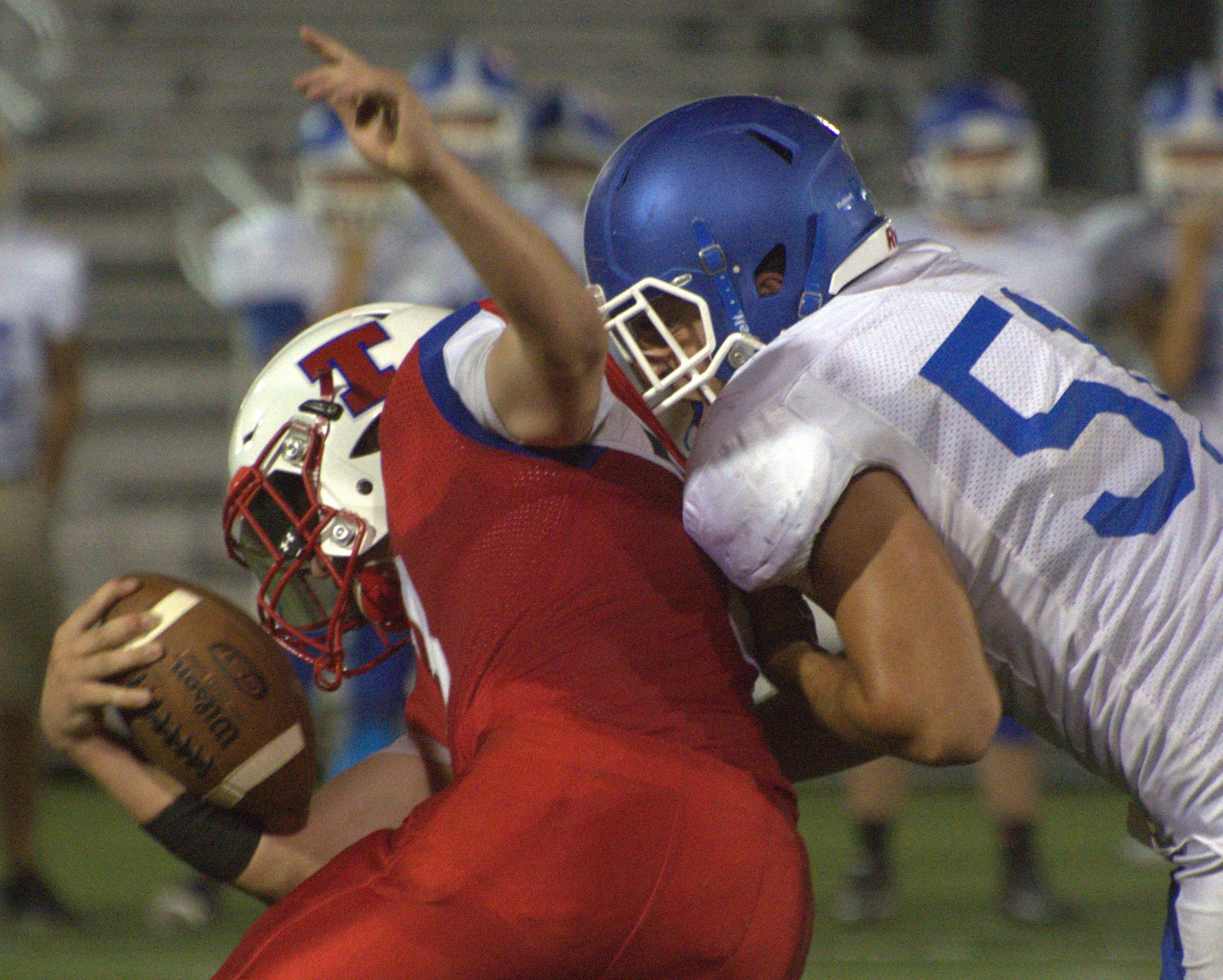 Hollis Brookline's Michael Moscatelli brings down Trinity's Colin Hines.