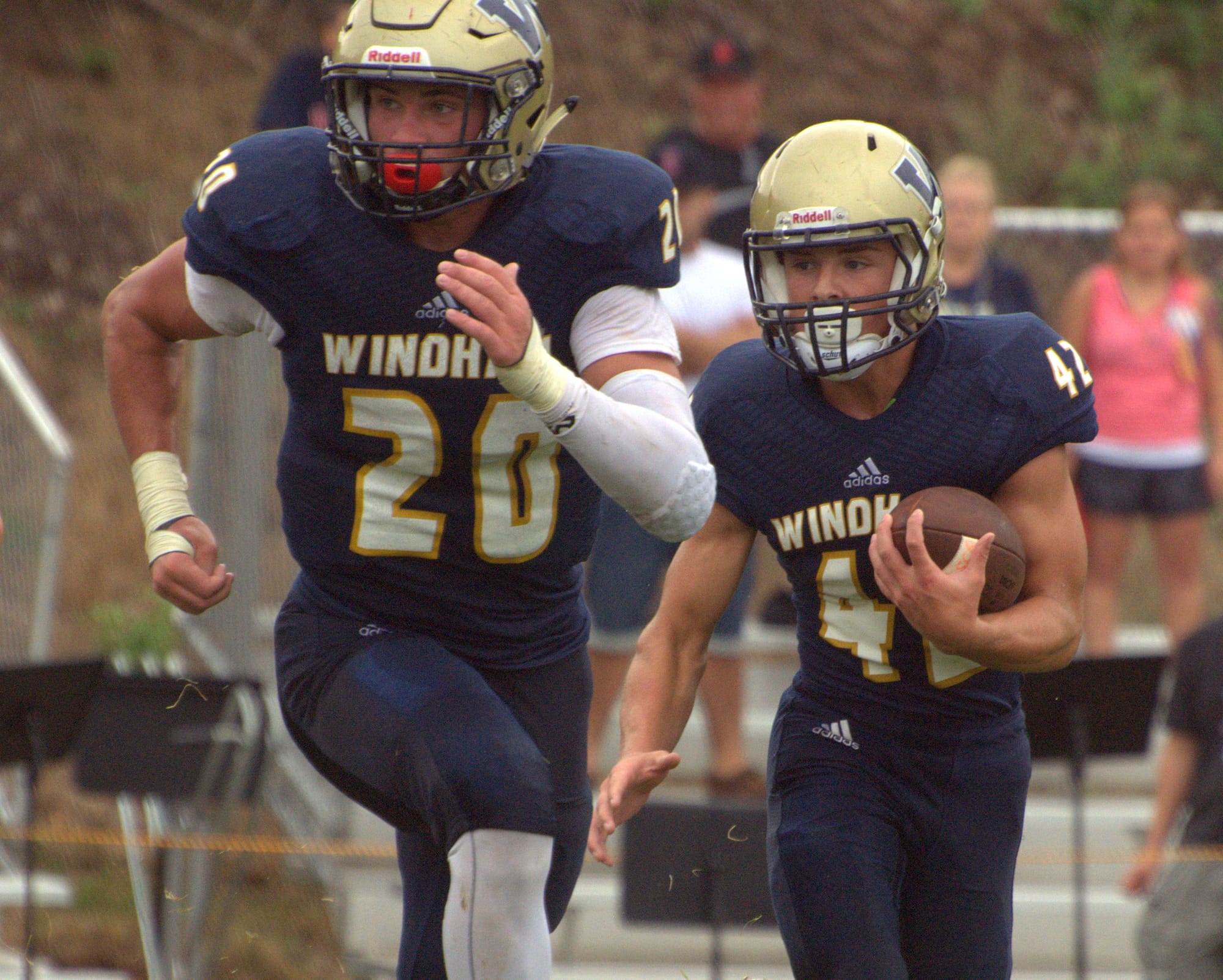 Windham's Victory Pizzotti, left, looks to make a block for Jake Aleksa.