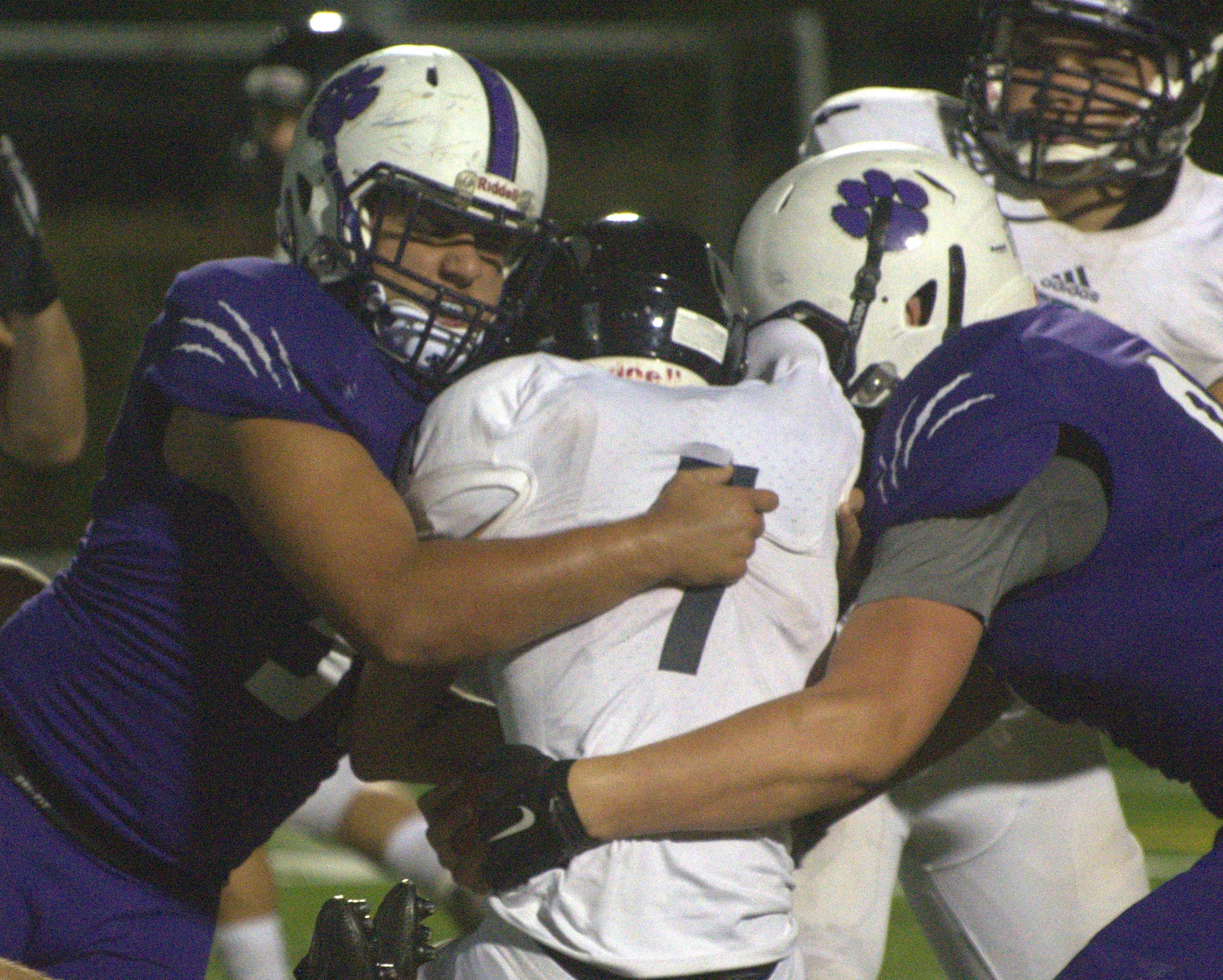 Nashua South's Timmy Daigneault wraps up Nashua North's Tylor Chase.