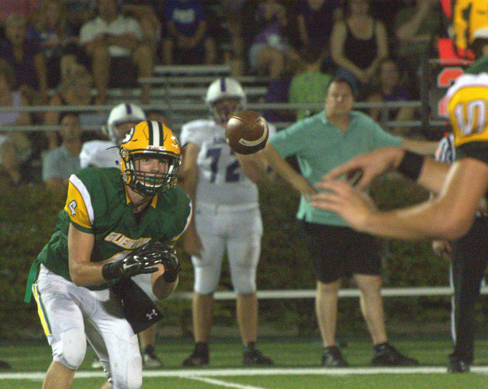 Bishop Guertin's Dylan Fagan looks in a pass from Sam Raitt.