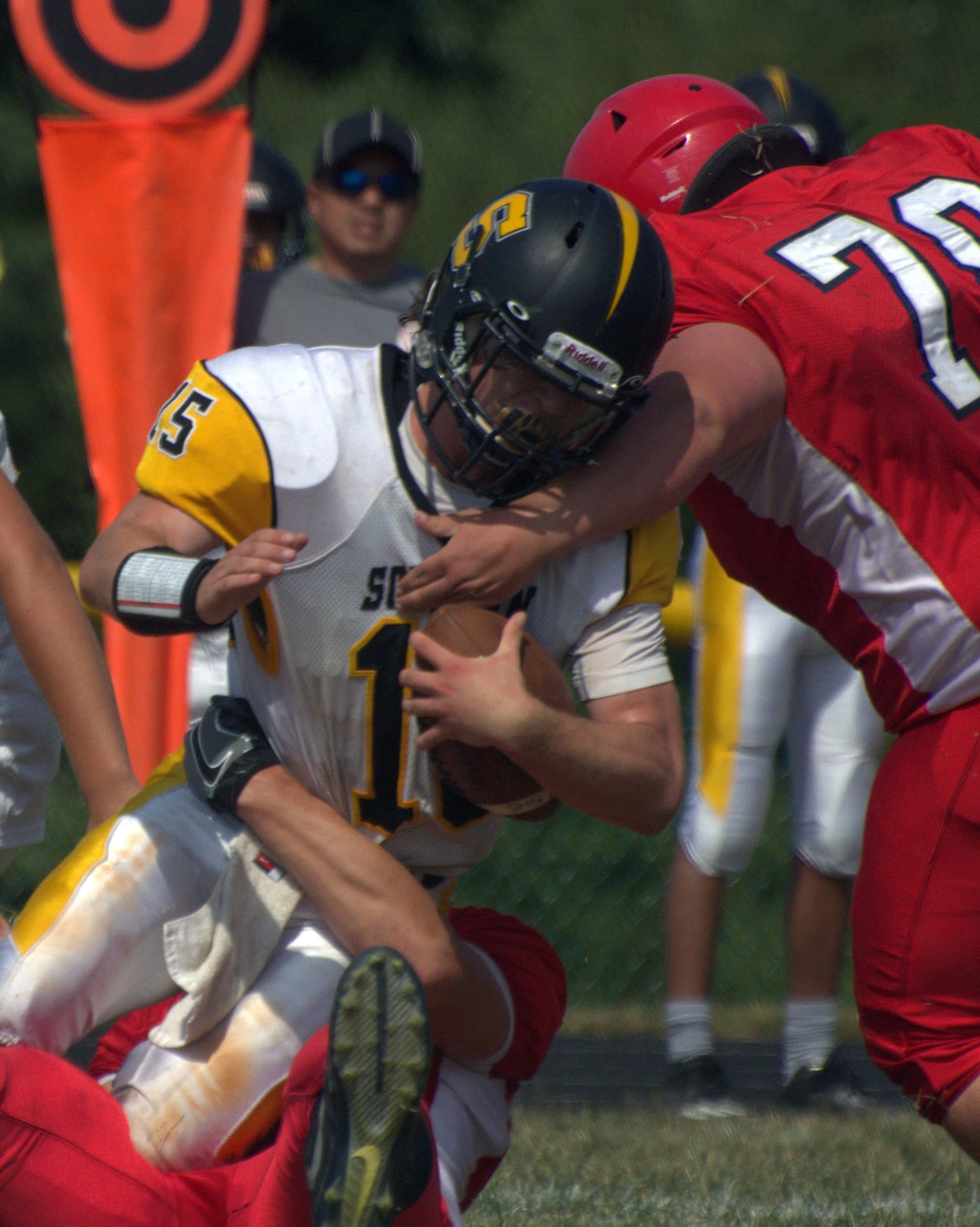 John Stark's Zach Handy, right, and Drew McQuarrie team up to bring down Souhegan's Palmer Belowski.