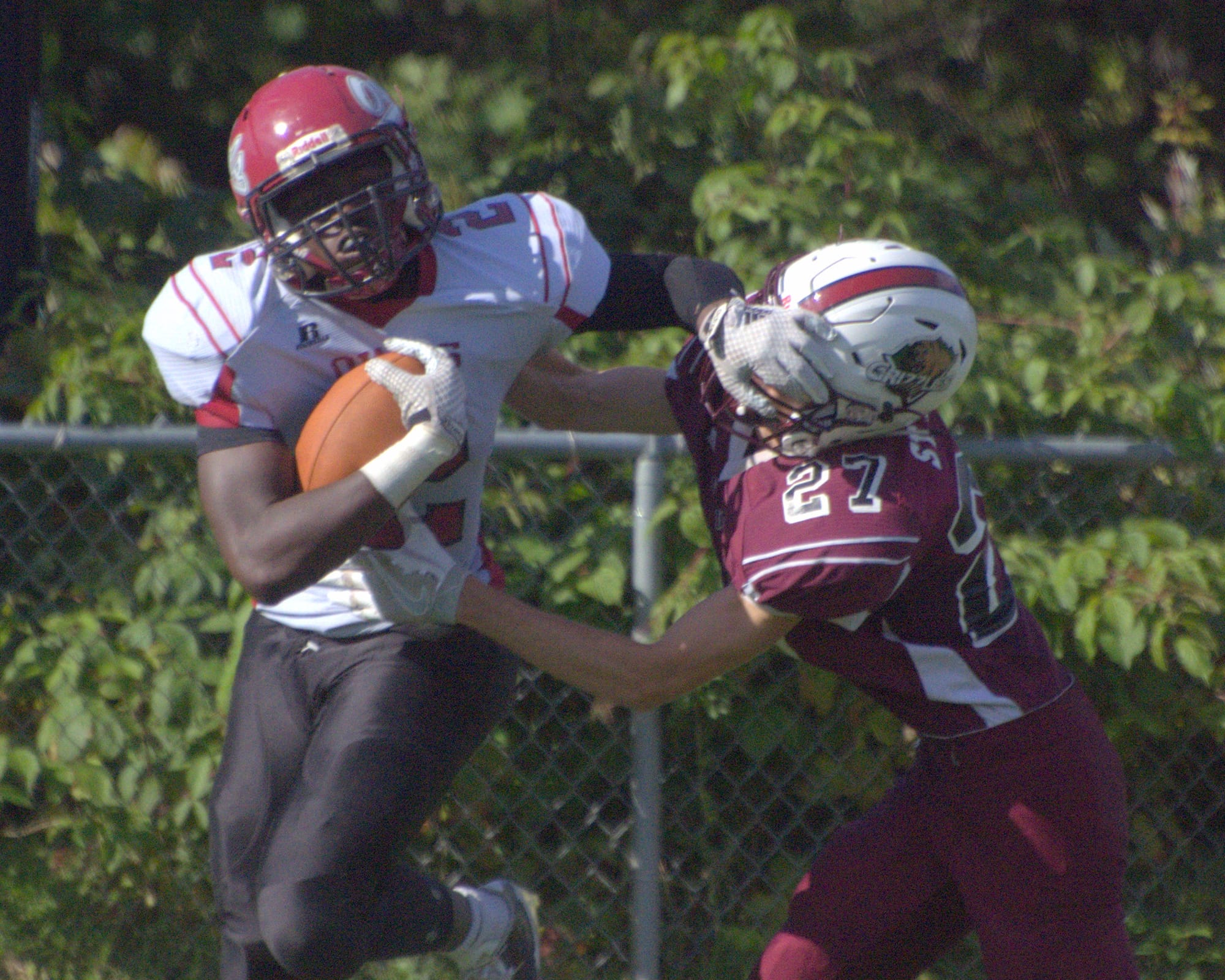 Goffstown's Brandon St. Onge tries to bring down Timberlane's Farai Zhou.