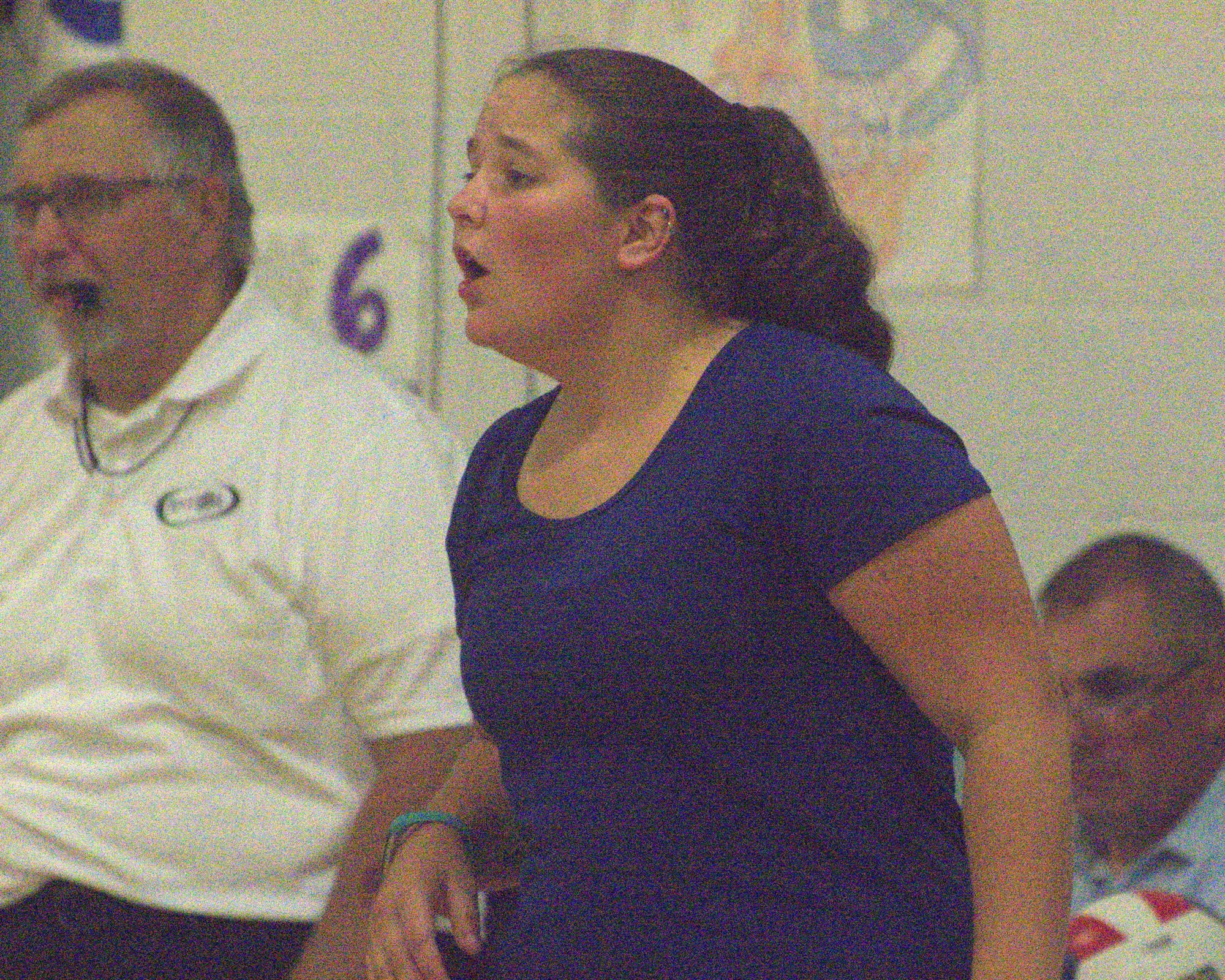 Milford coach Beth Solan talks to her team during a game this season.