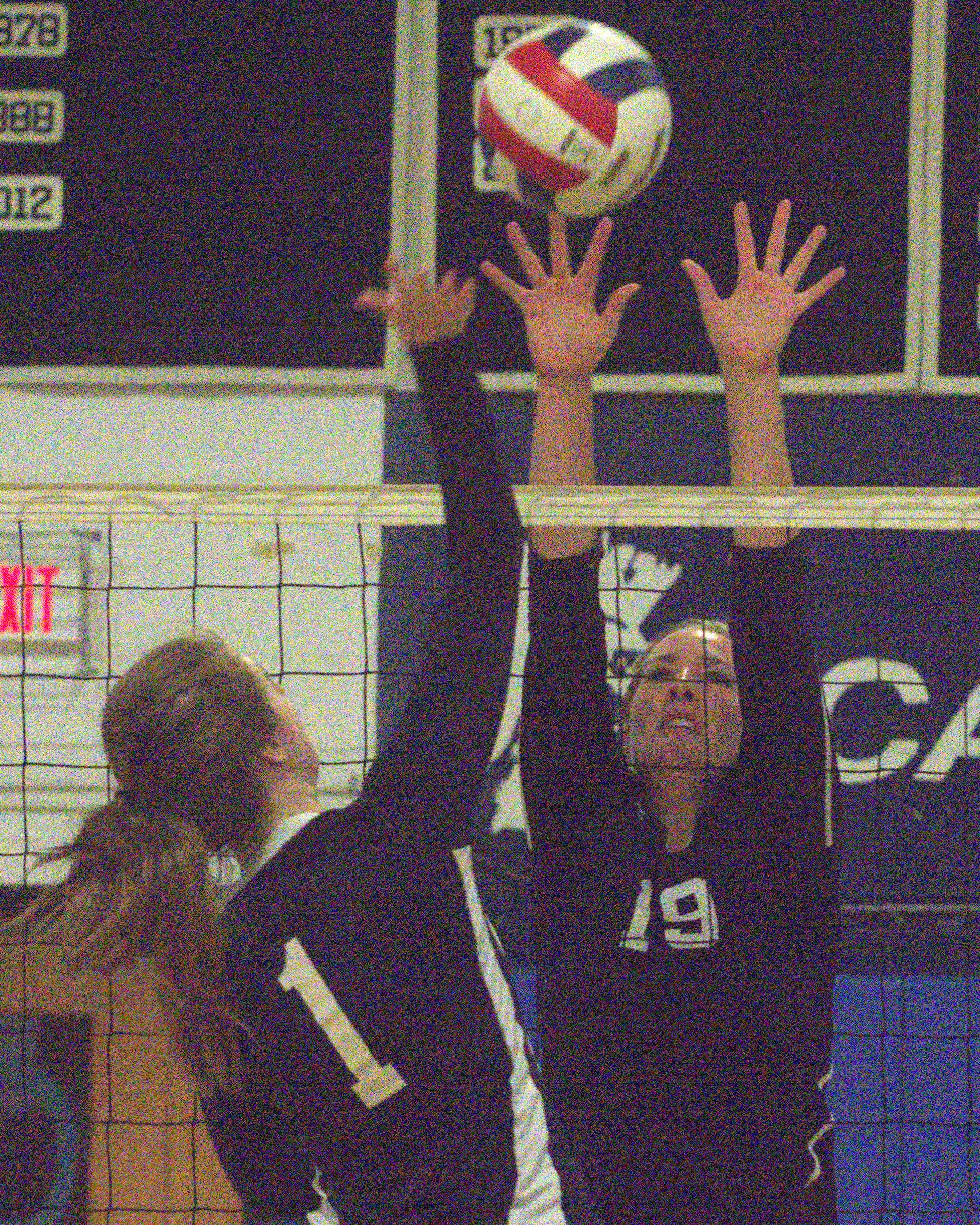 Windham's Casey Dinga tries to block a ball hit by Milford's Julia Mrozek.