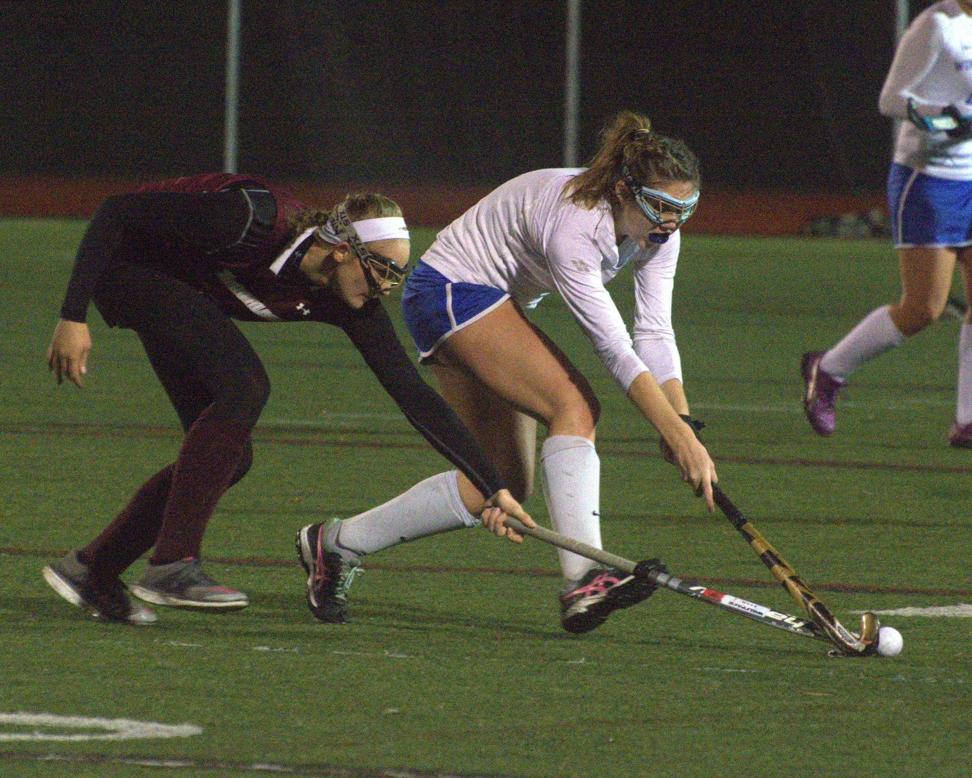 Timberlane's Kylie Fitzpatrick and Winnacunnet's BRachel Ingham fight for the ball.
