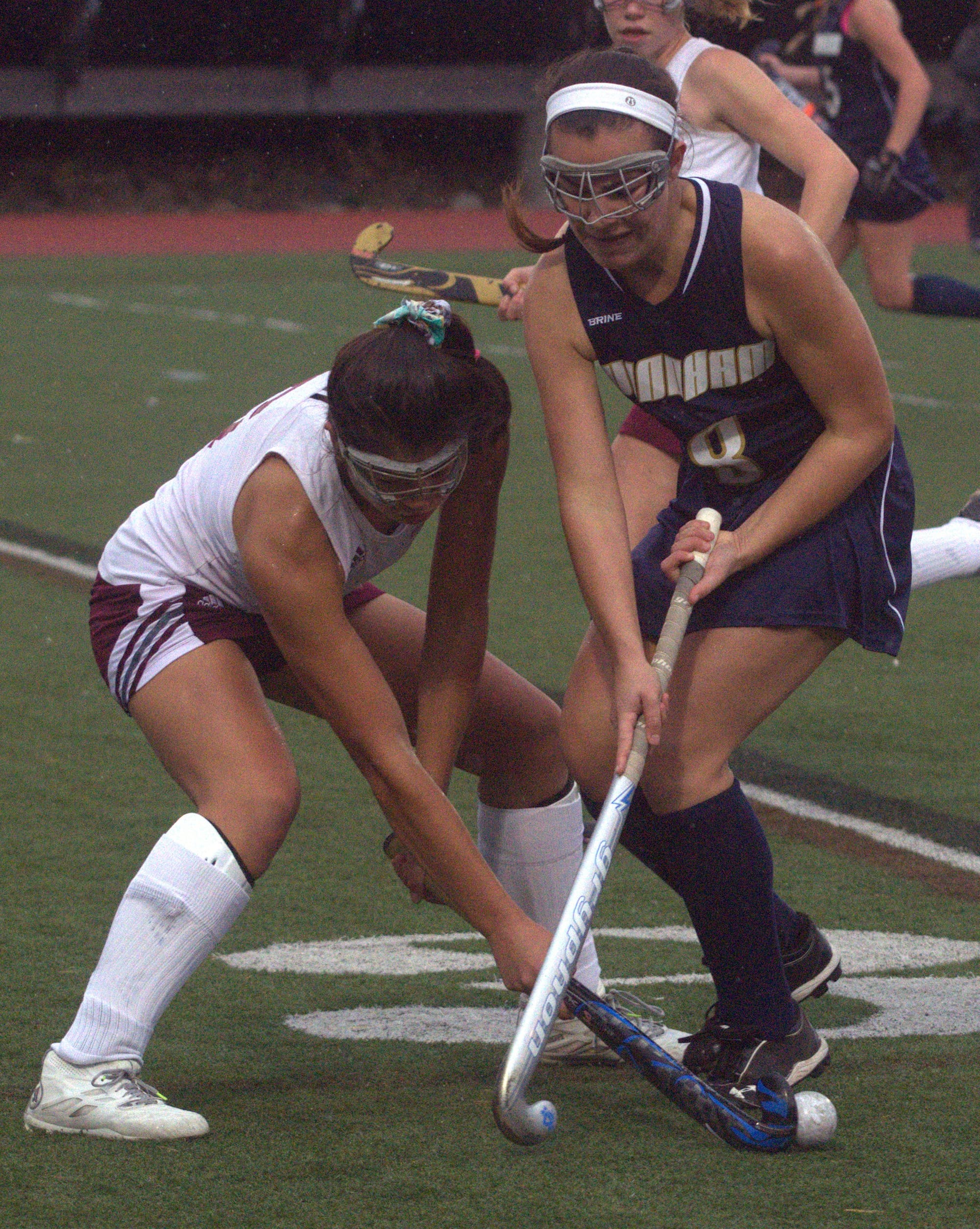 Windham's Brianna Langlois and Derryfield's Annalise Groves battle for the ball.