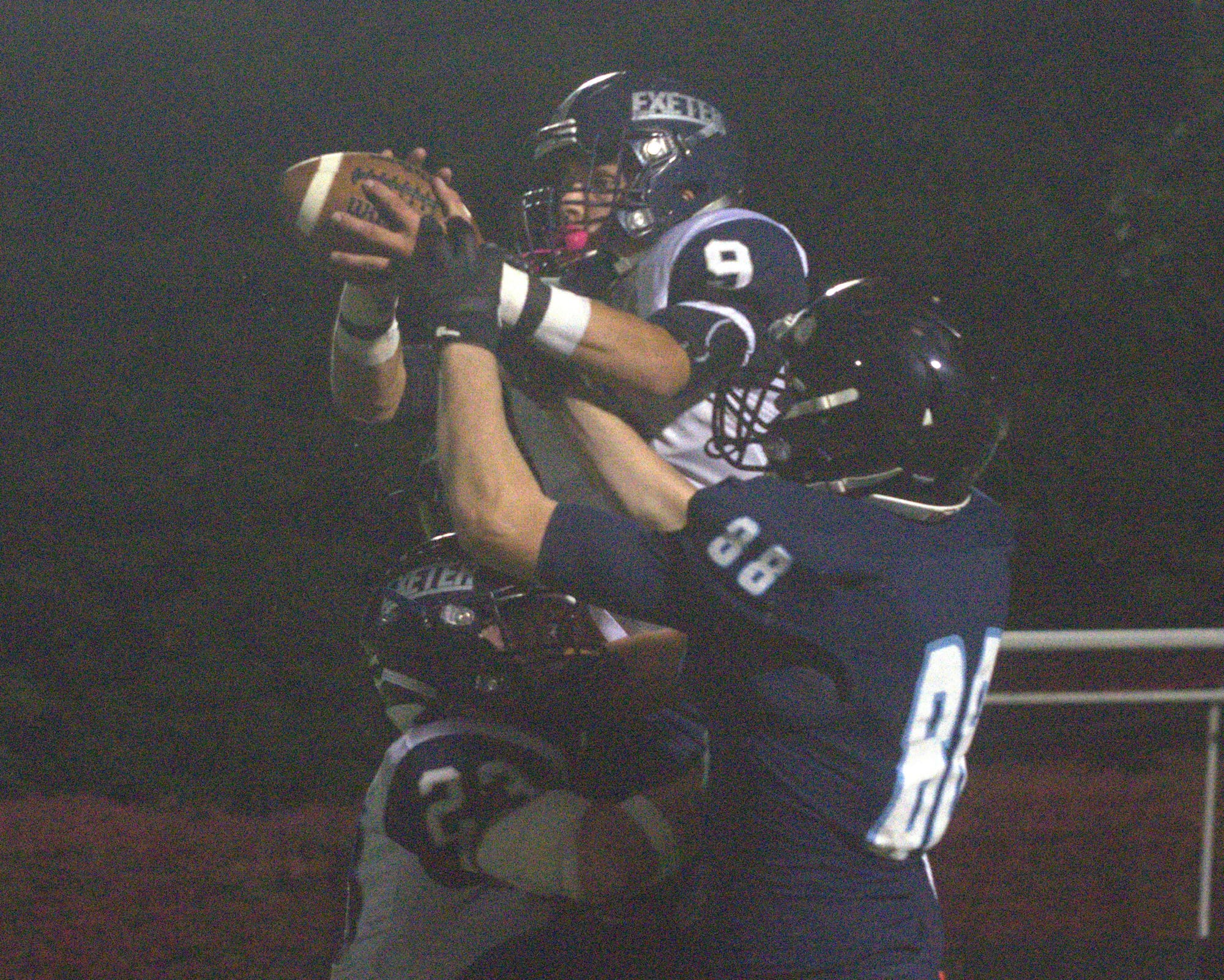 Exeter's Kyle Ball intercepts a pass to North's Steve Lambert.