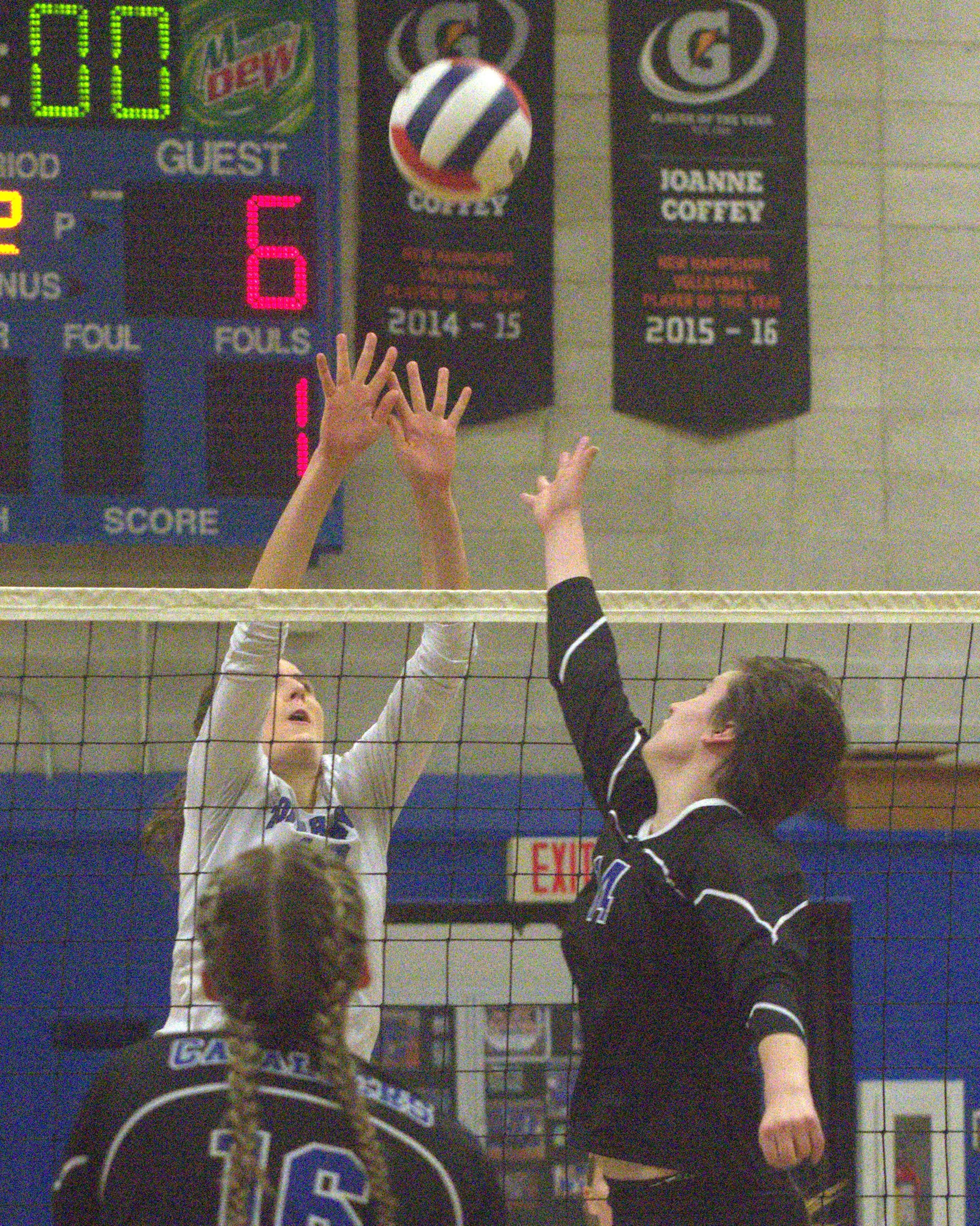 Merrimack's Brianne Nordengren tries to get a piece of a ball hit by Hollis Brookline's Hannah Balfour.