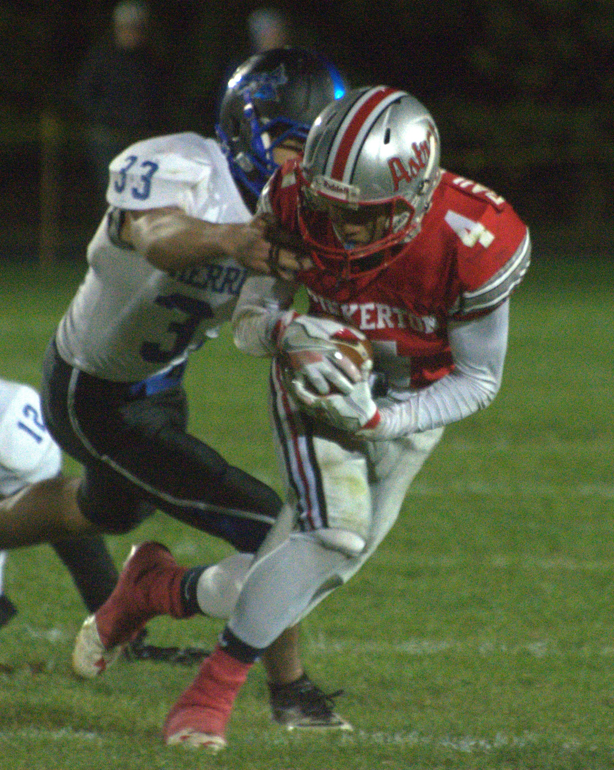 Pinkerton's Kayden Baillargeon tries to get away from Merrimack's Tristan Wood.