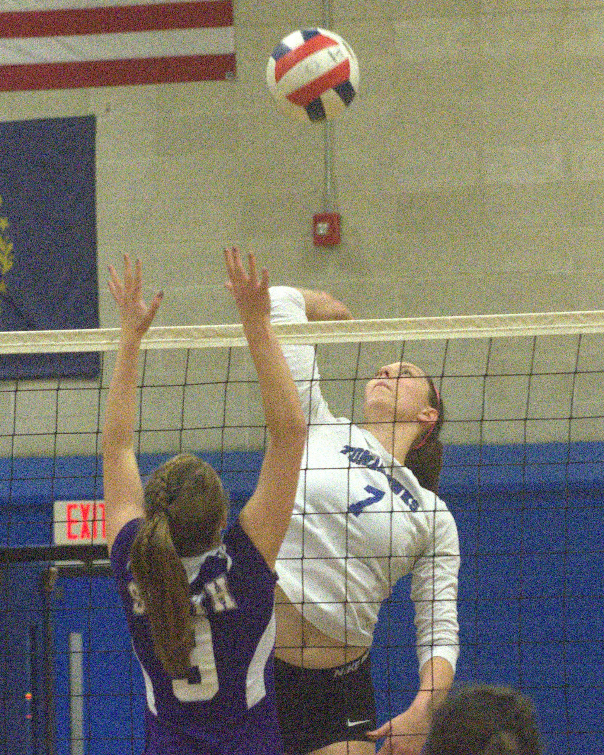 Merrimack's Elise Jolly goes up to hit the ball.