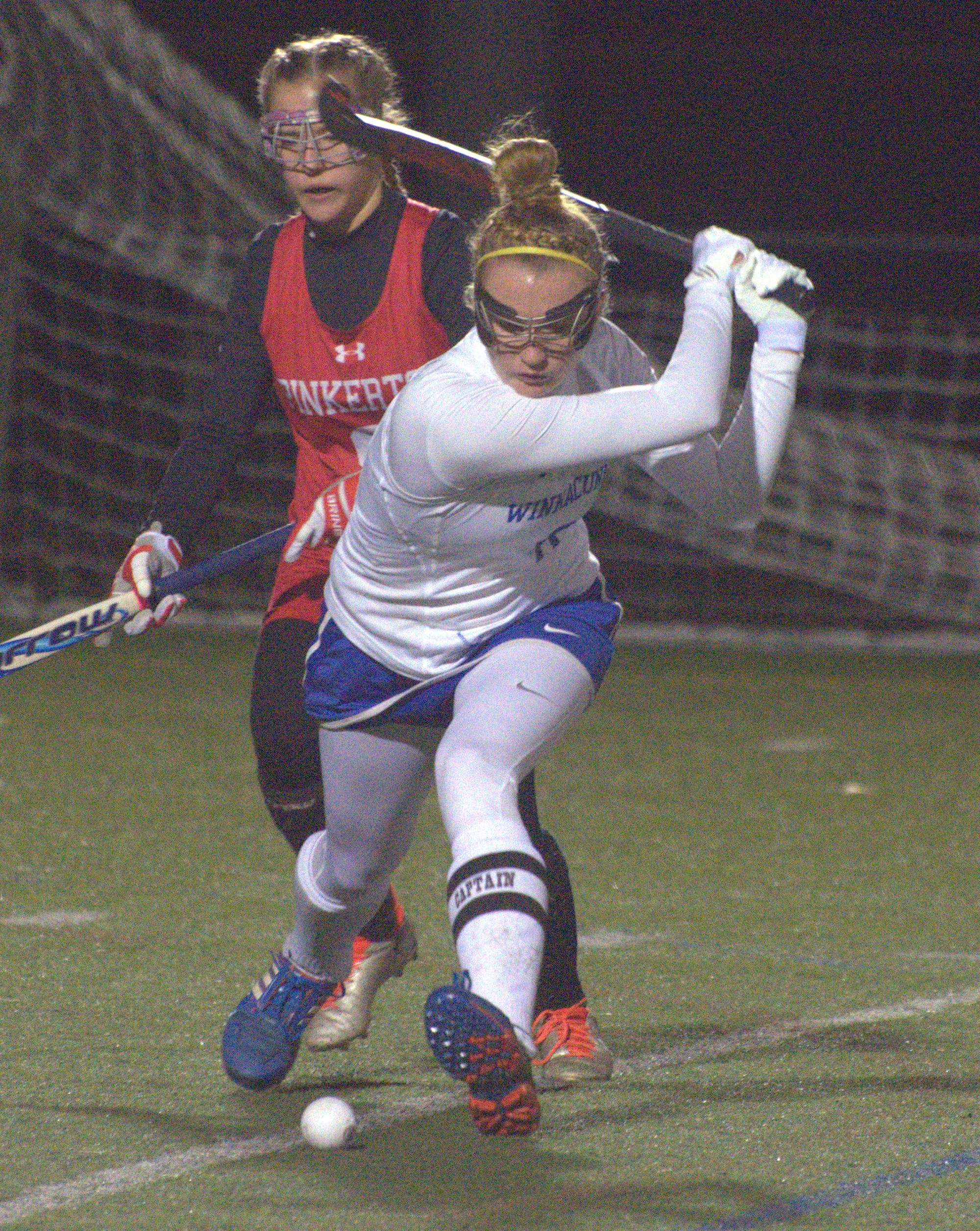 Winnacunnet's Abby Merrill takes a swing at the ball.