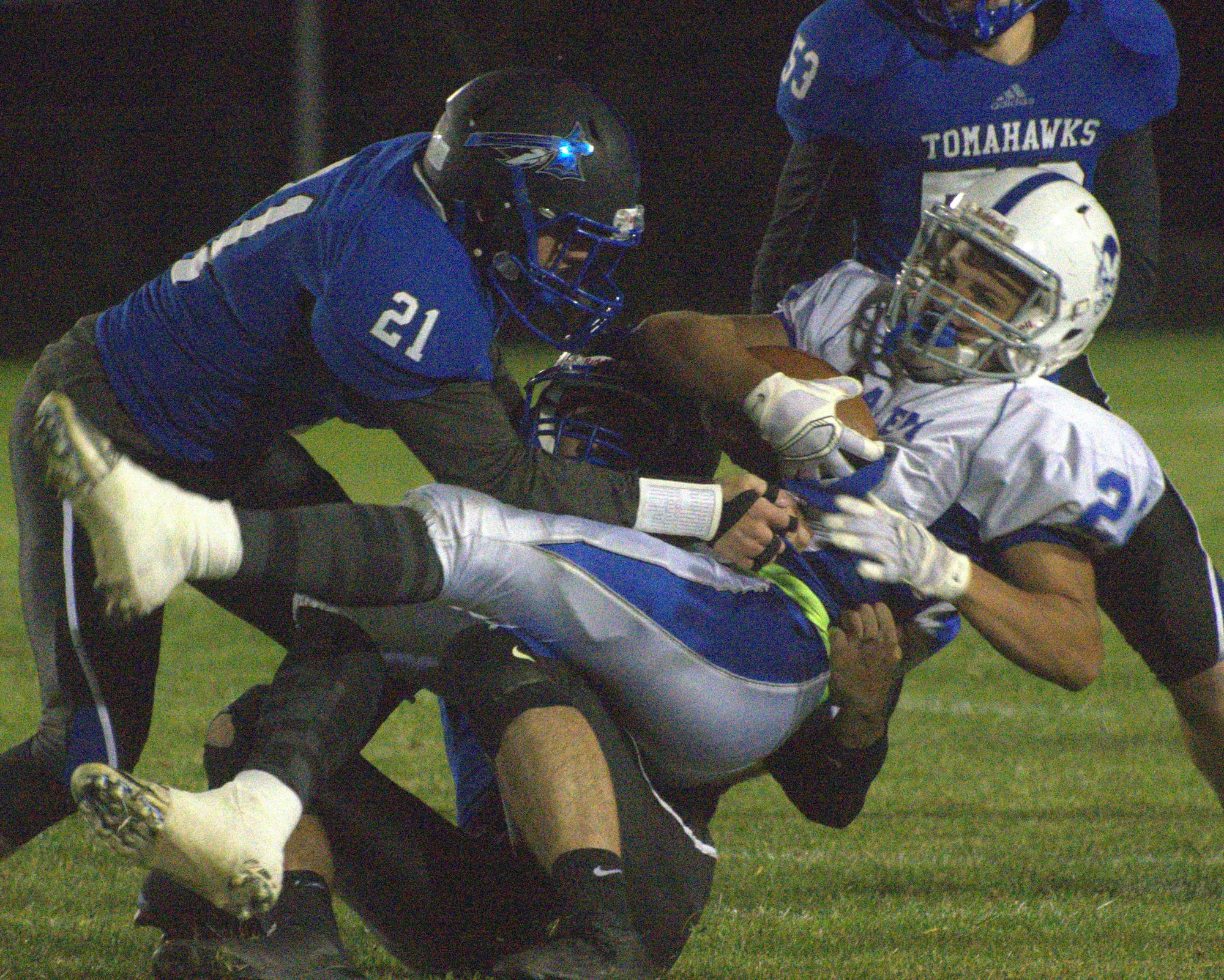 Merrimack's Avery Paulson helps to bring down Salem's Josh Maroun.