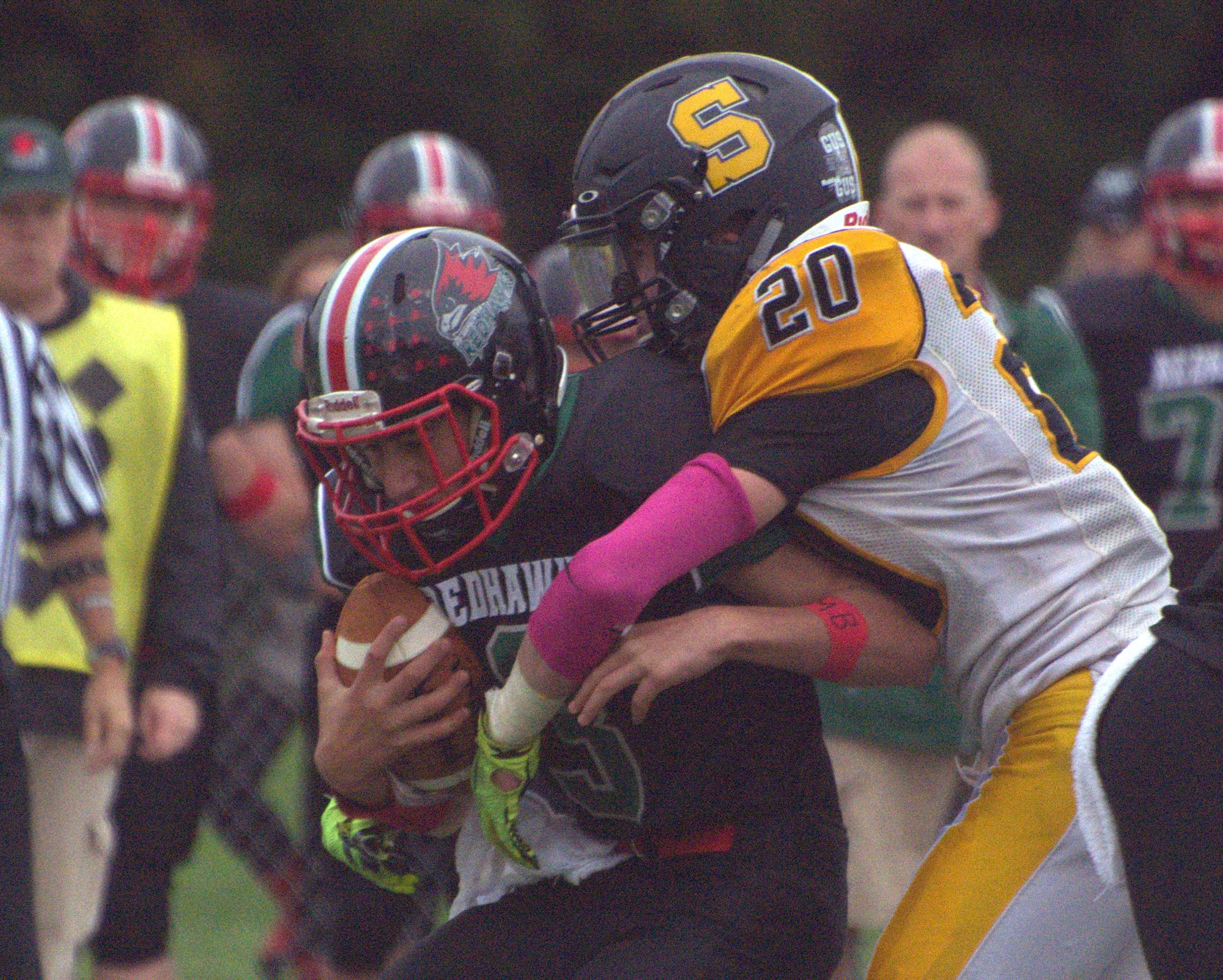 HDH's Caleb Yianakopolos is sacked by Souhegan's Jacob Grassett.