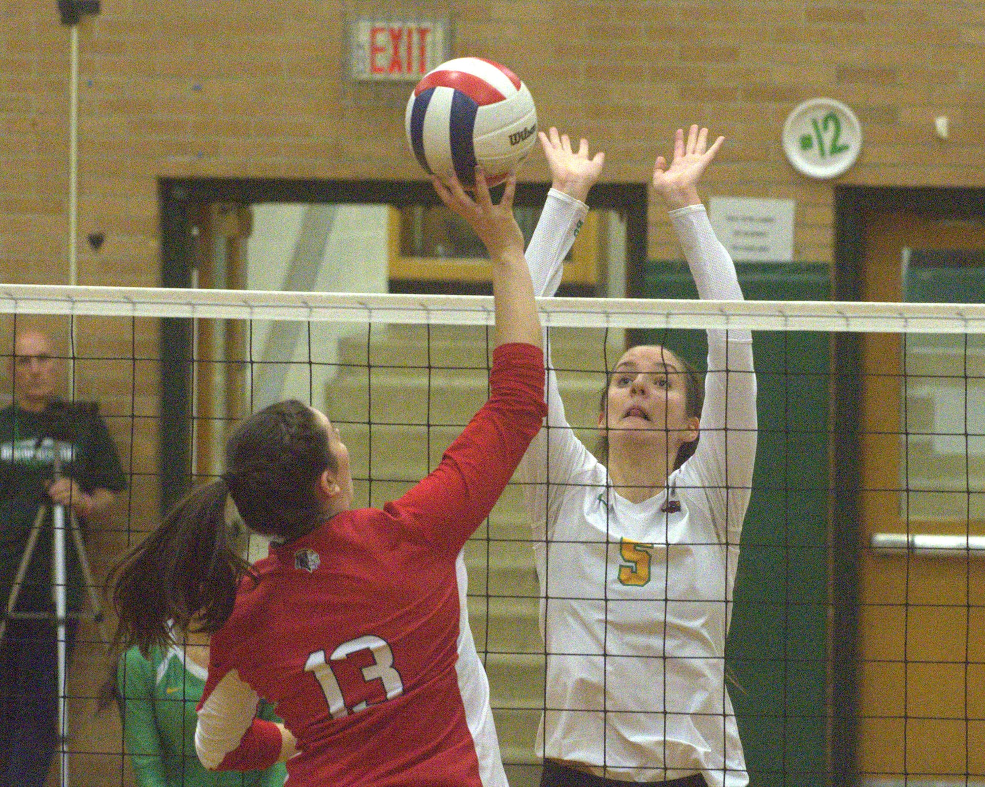 Bishop Guertin's Margaret Richardson tries to block a ball hit by Spaulding's Faith George.