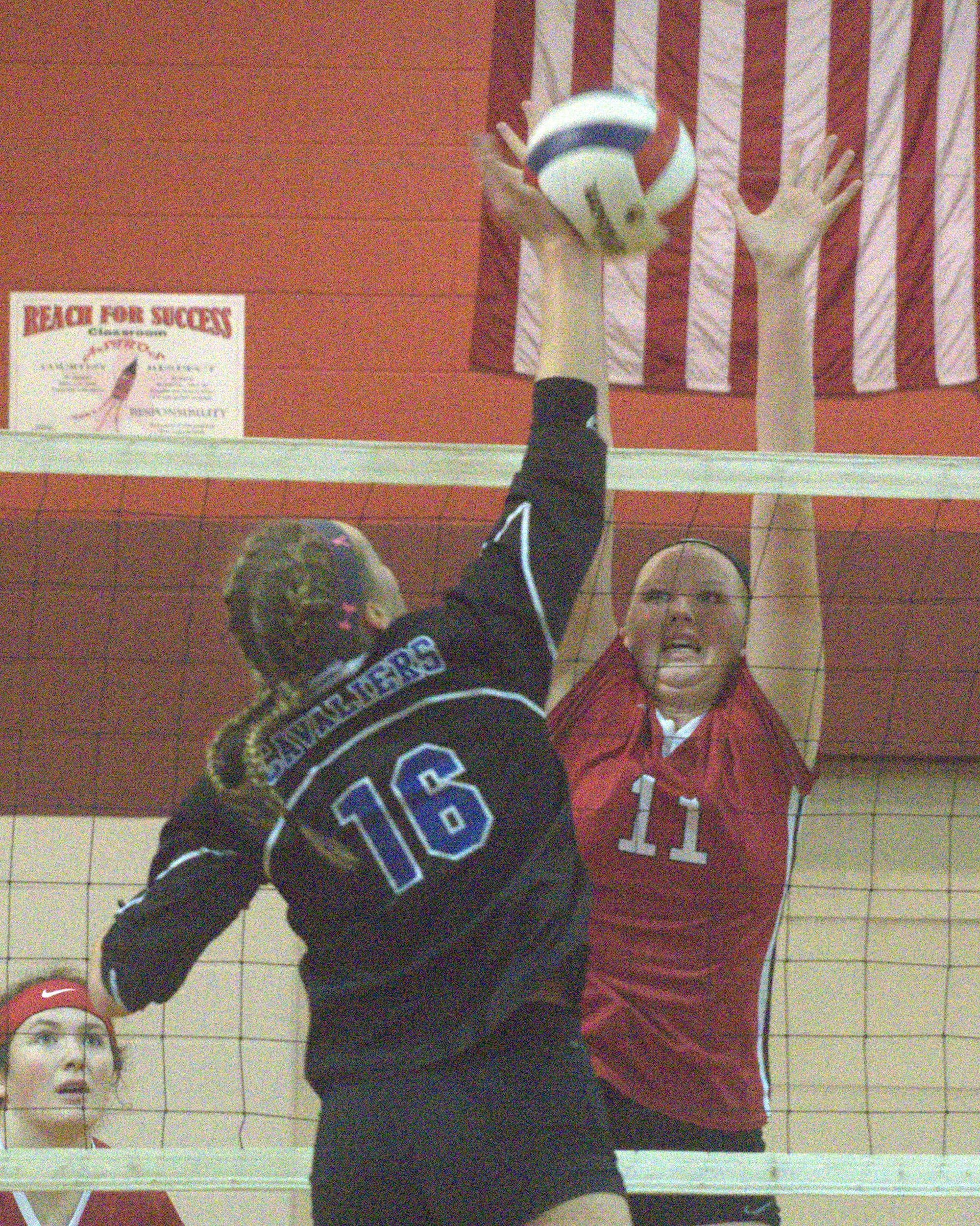 Concord's Lauren Hatch tries to block a ball hit by Hollis Brookline's Maddie Norris.