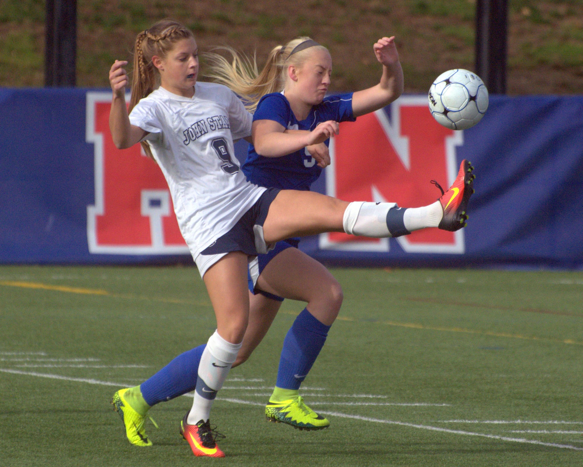 John Stark's Brooke Shatney and Oyster River's Sierra Carpenter battle for the ball.