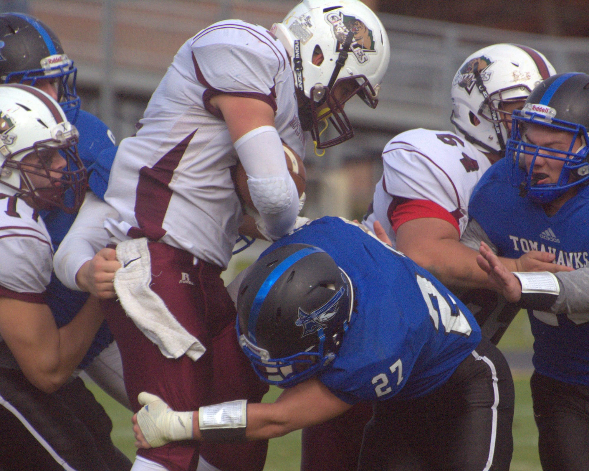 Merrimack's Nick Marchand tries to wrapup Goffstown's Carter Cormier.