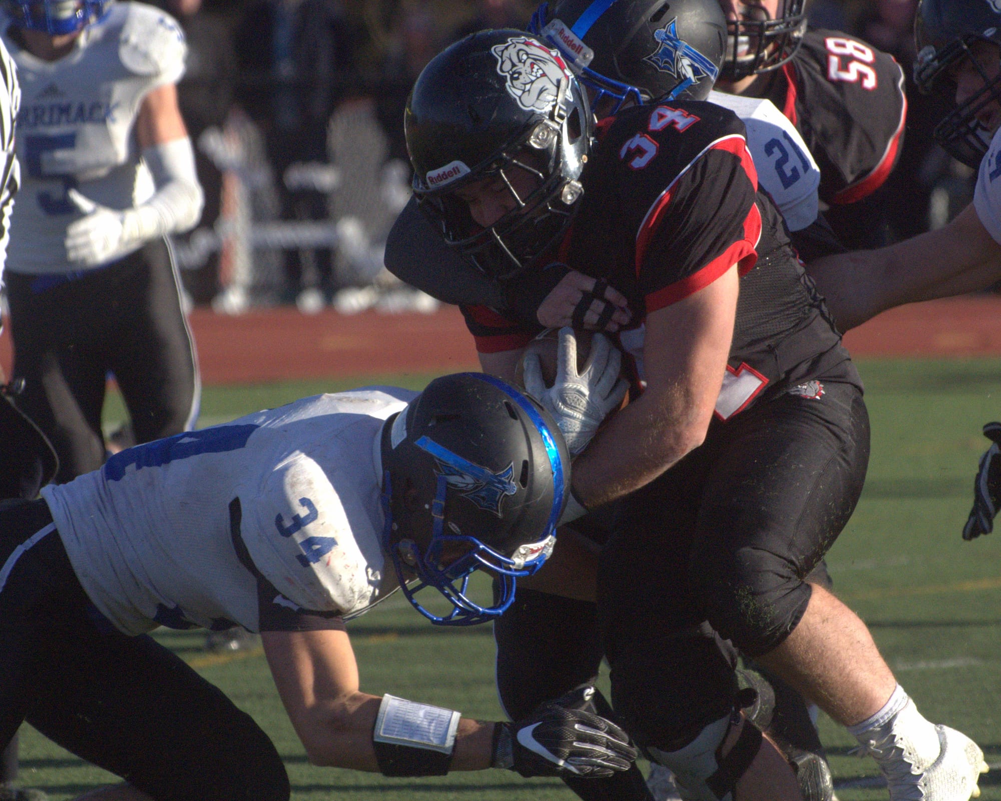 Bedford's Sean Tierney tries to get by Merrimack's Alec Bronchuck.