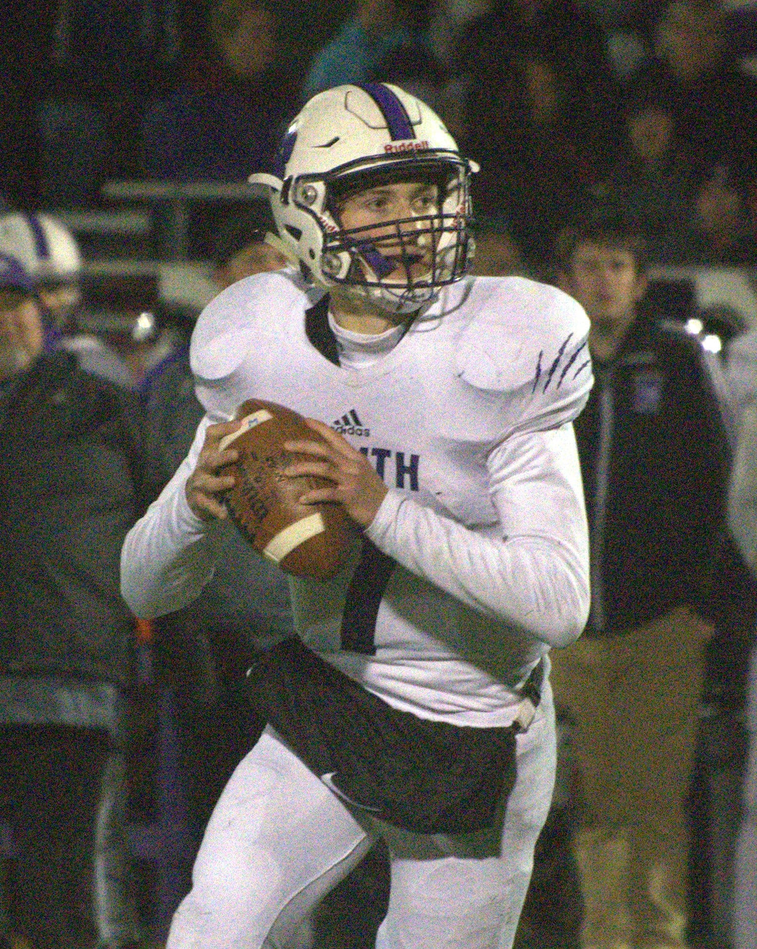 Nashua South's Sean Holland looks for an open receiver.
