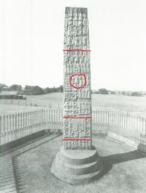 Black and white photo of a tall, upright stone slab covered with carvings depicting multiple scenes from a battle.