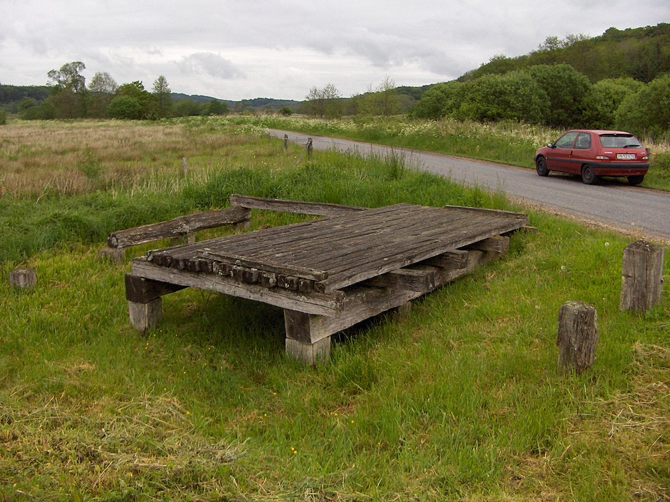 A reconstruction of a small section of the 10th century Ravning Bridge in Denmark. It's made of wooden piles with flat planks laid across. This bridge would have been flat and was perhaps designed for ease of troop movements across marshy ground, as it does not cross a body of water. 